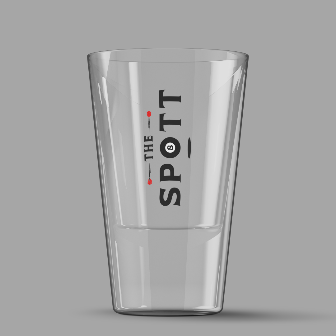 A clear glass with the words "The Spot" in black and a small black spot with the number 8 inside, printed vertically on the side.