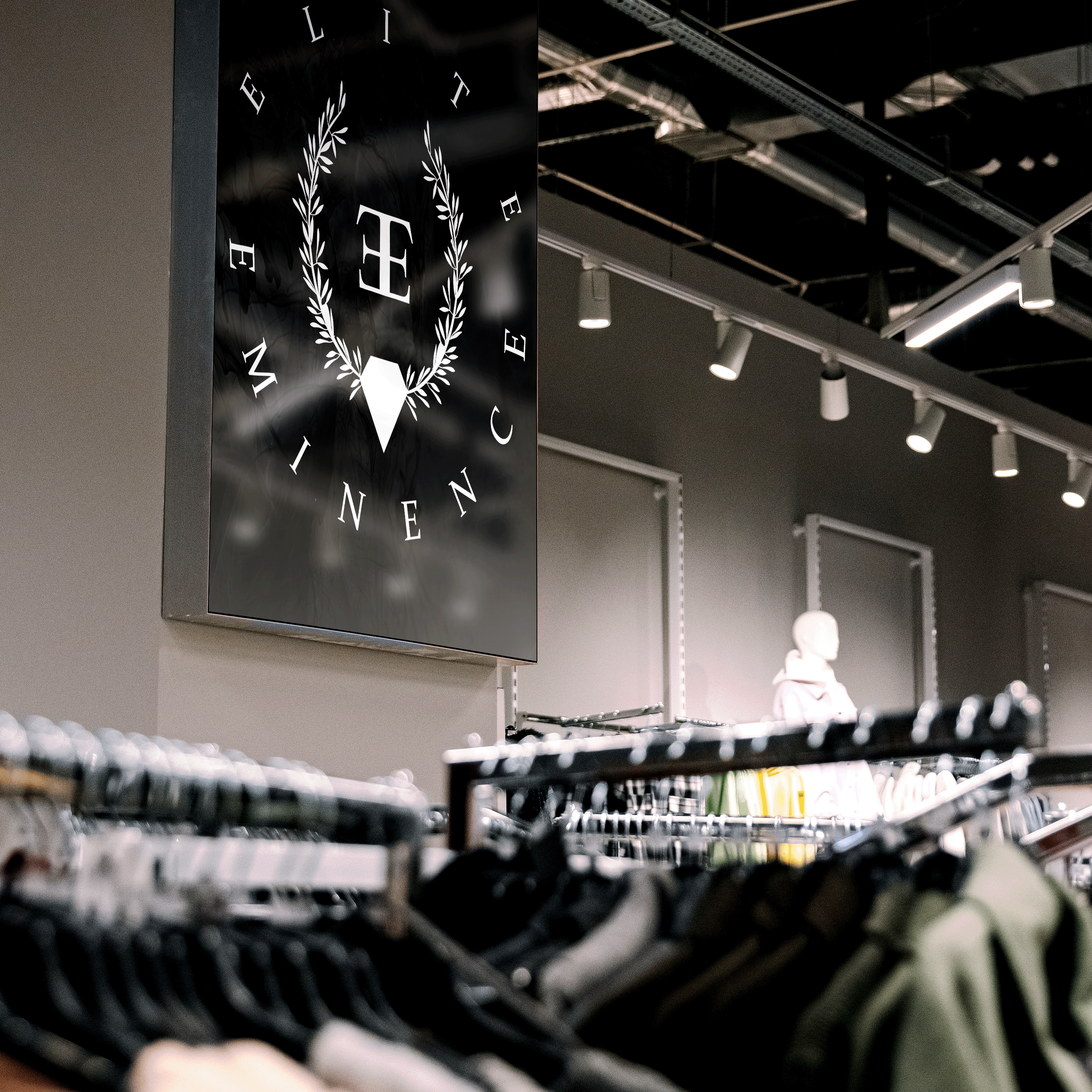Clothing store interior with racks of clothes and a prominent black sign with the logo and text 'LITE WINTER' on the wall.