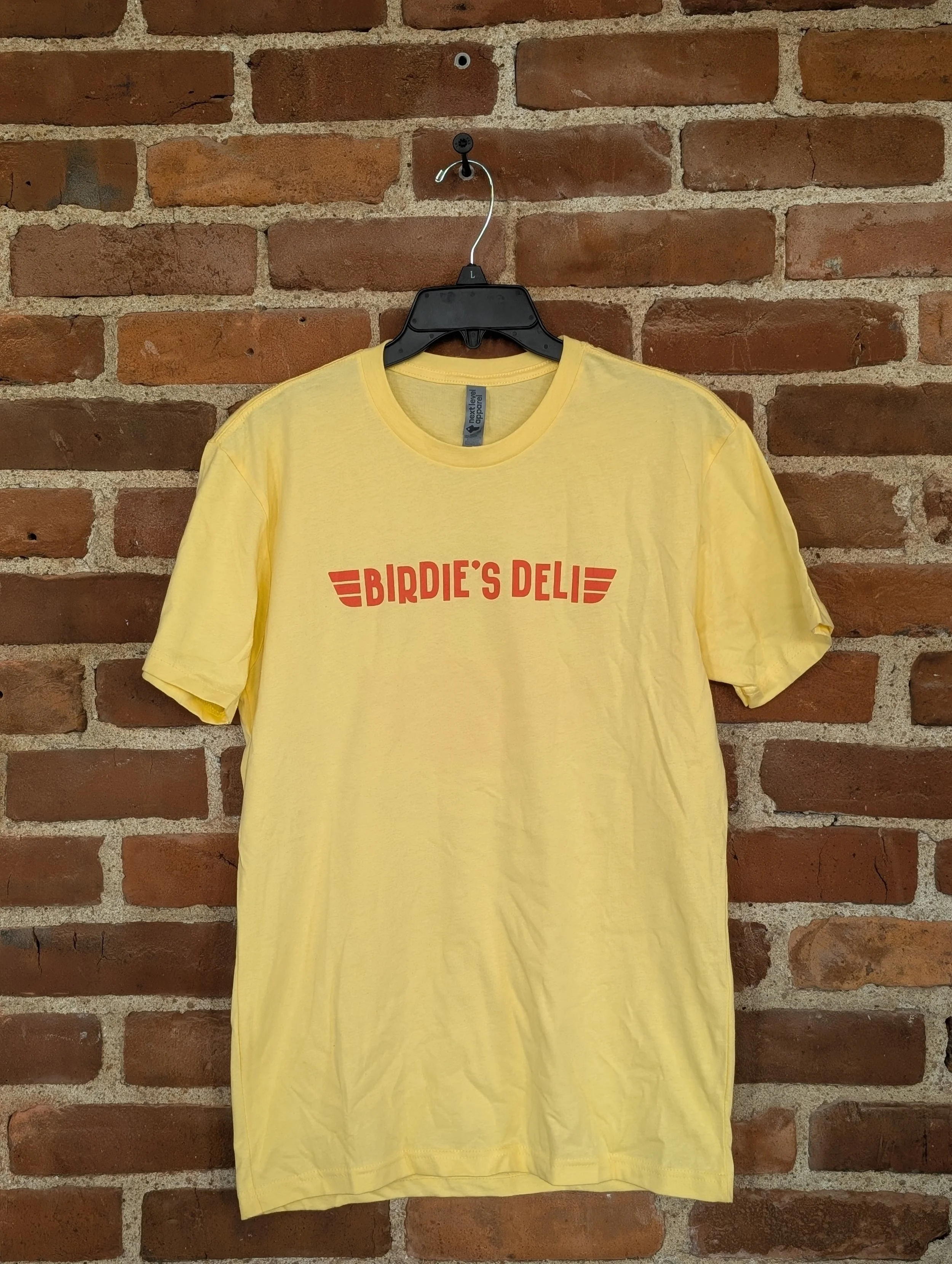 Yellow Birdie's shirt