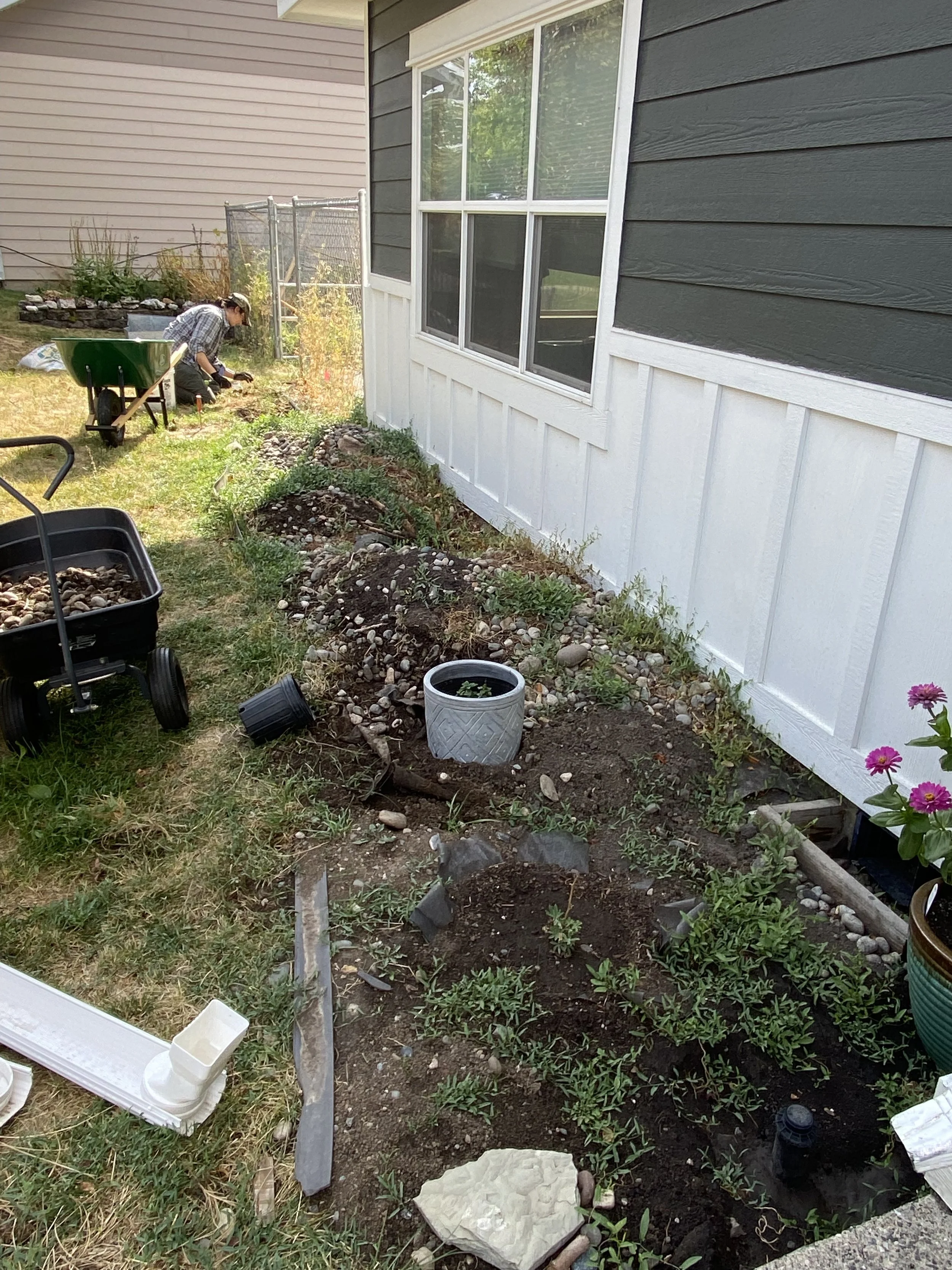 Top Layer: bindweed, dirt, rocks, added rocks, edging, weed mat.
Second Layer: more bindweed, dirt, rocks, added rocks, edging and weed mat.
Bottom Layer: clay, dirt, rocks.
