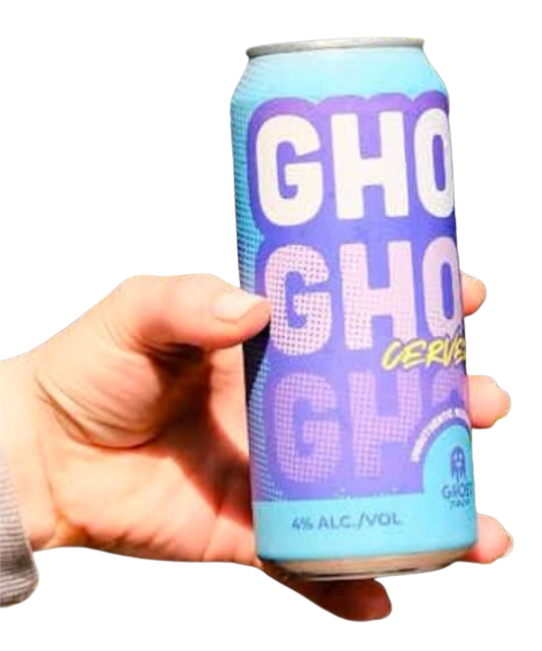 Person holding a blue can with purple and yellow text reading "GHOST CERVEZA" and 4% alcohol content.