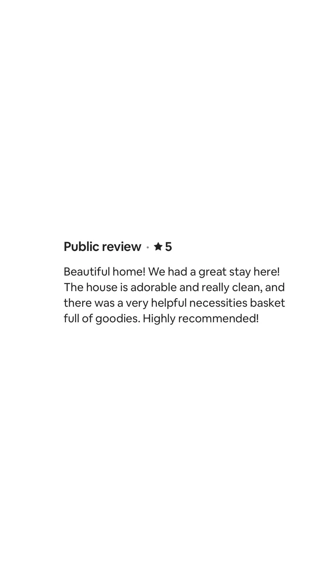 Screenshot of an online review describing a pleasant stay at a clean and cute home with a helpful basket of necessities, highly recommended.