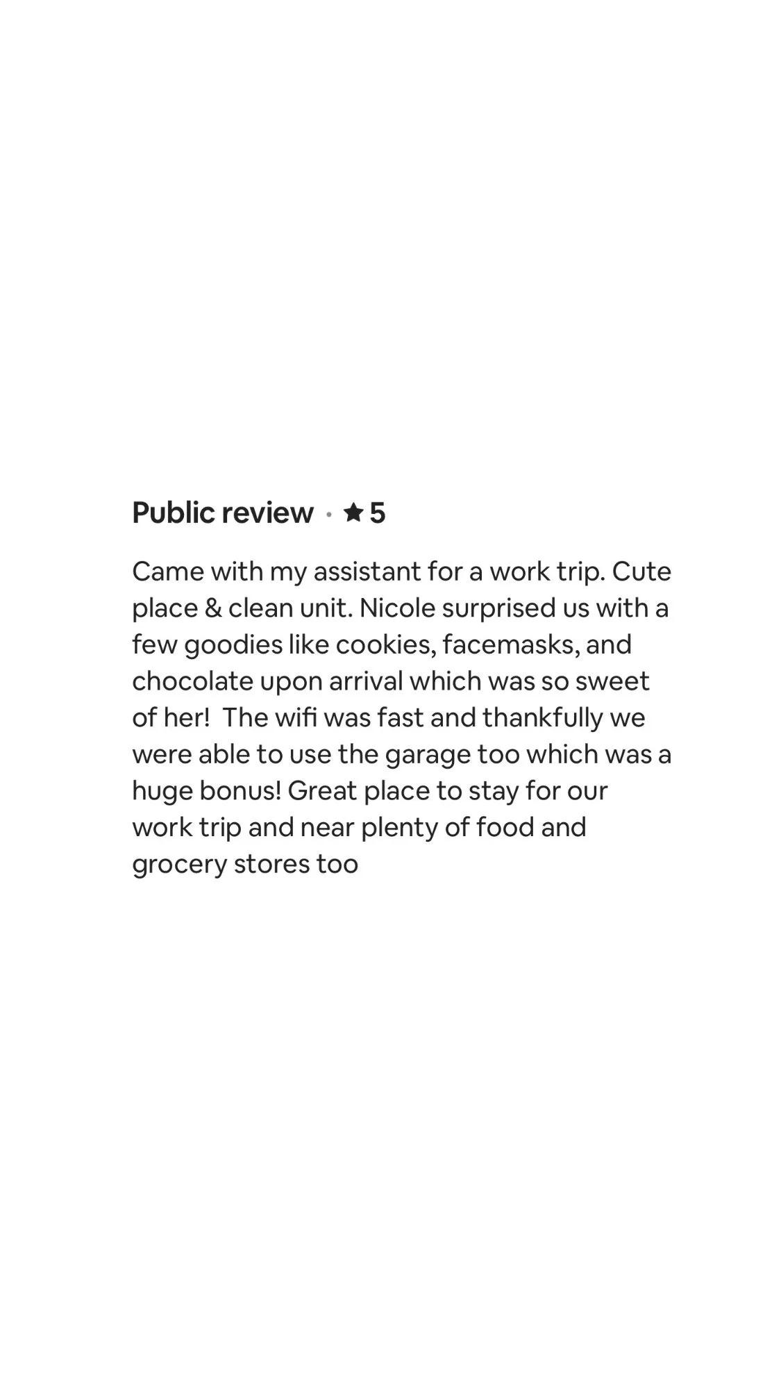 Screenshot of a hotel review about a positive stay, mentioning a work trip, friendly staff, good amenities, fast Wi-Fi, and nearby food options.
