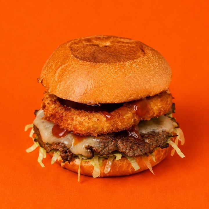 Best Onion Ring Burger NYC – Classic Beef, Cheddar, BBQ Sauce &amp; Fresh Toppings!