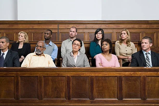 People sitting in a courtroom.