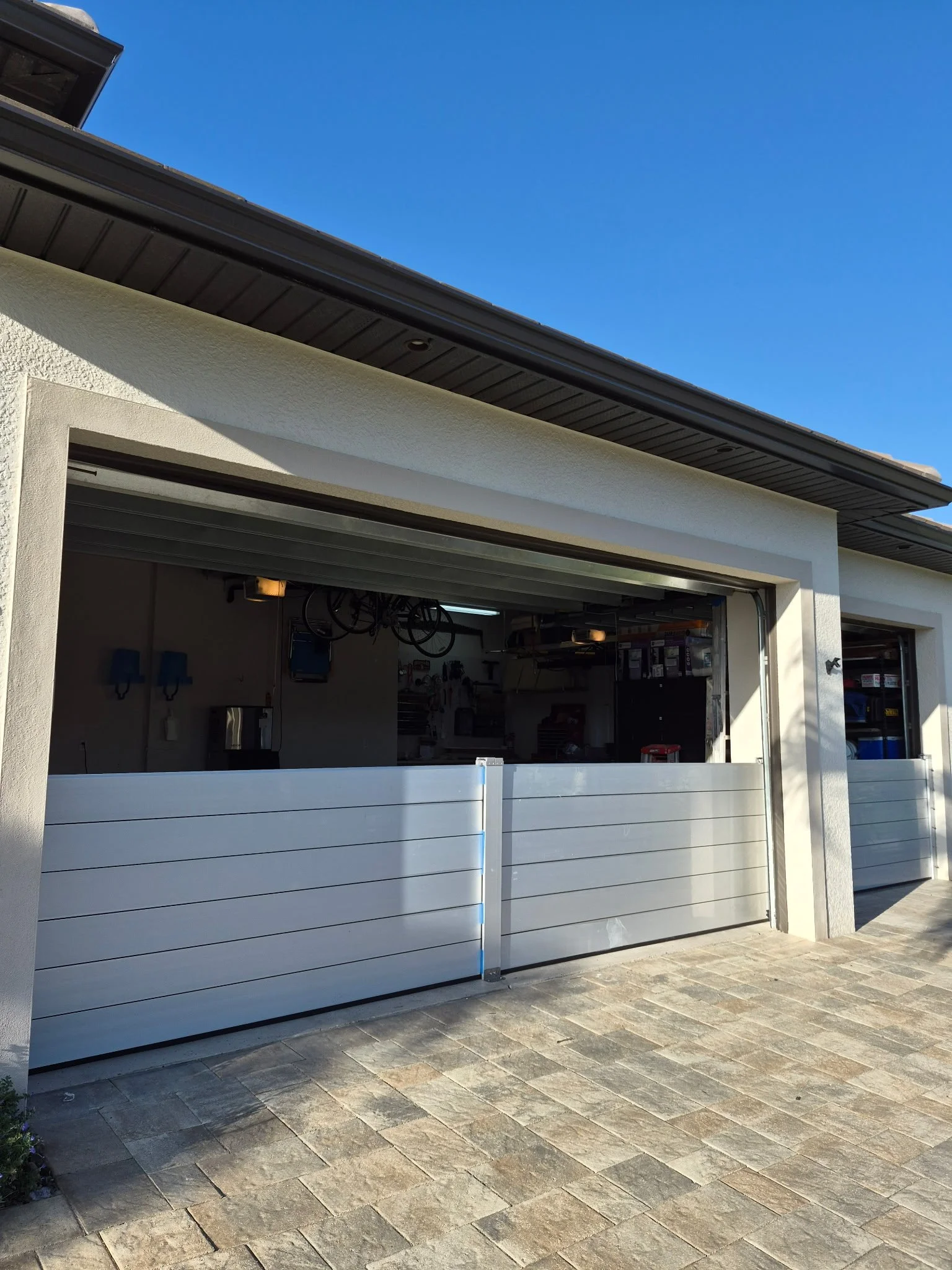 A house in Punta Gorda on the water with flood barriers installed for flood protection. These barriers will help protect against hurricane damage and water damage.