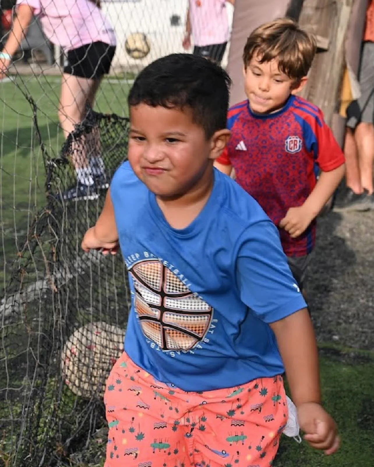 Two little ones.
No scoreboard. No crowd.
Just a dusty field, bare feet,
and a ball that might as well be the moon.

They chase it like a dream&mdash;
laughing, stumbling, soaring&mdash;
not for trophies, but for joy.

This is the love of the game.
T
