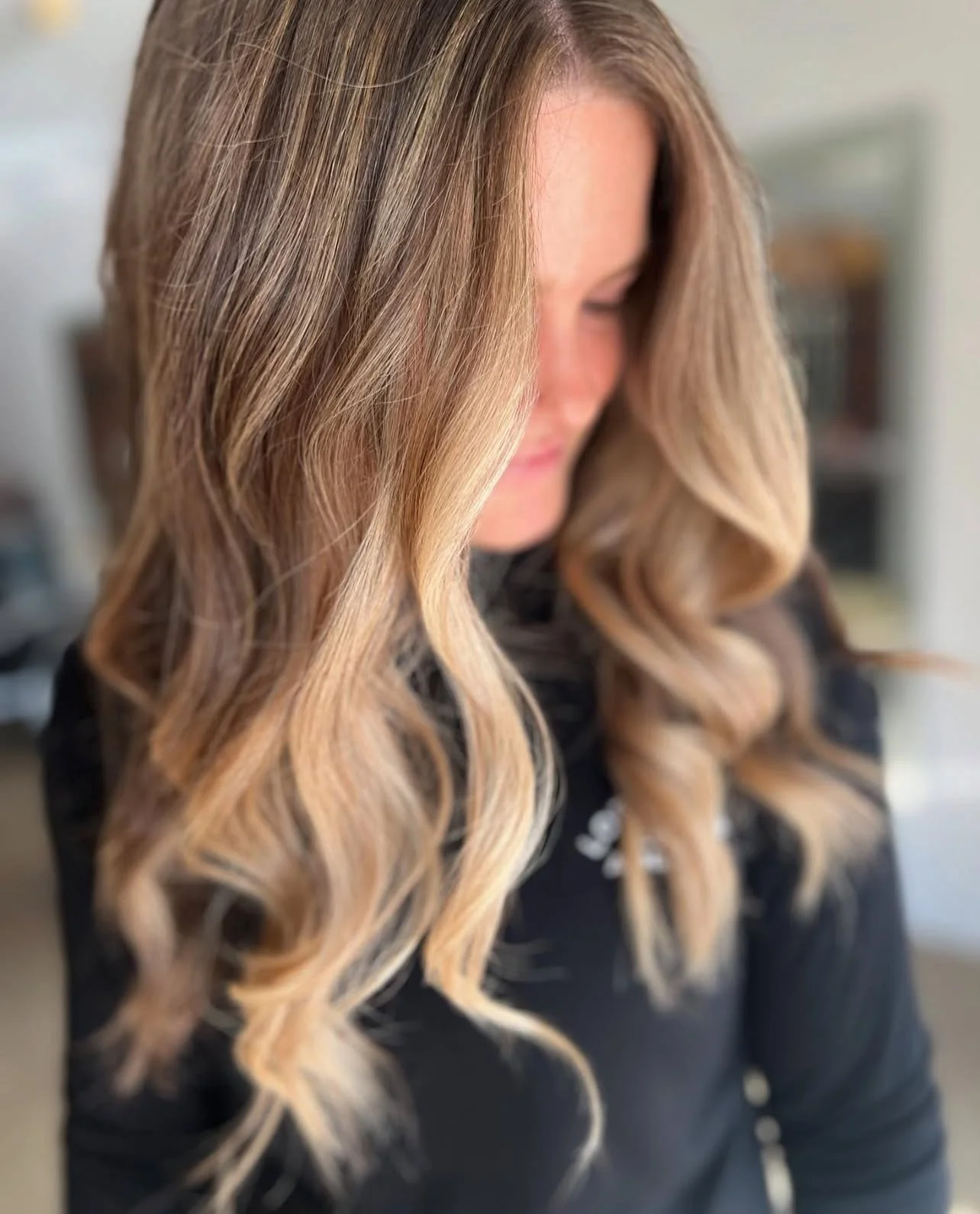 Salon customer with new long natural highlights