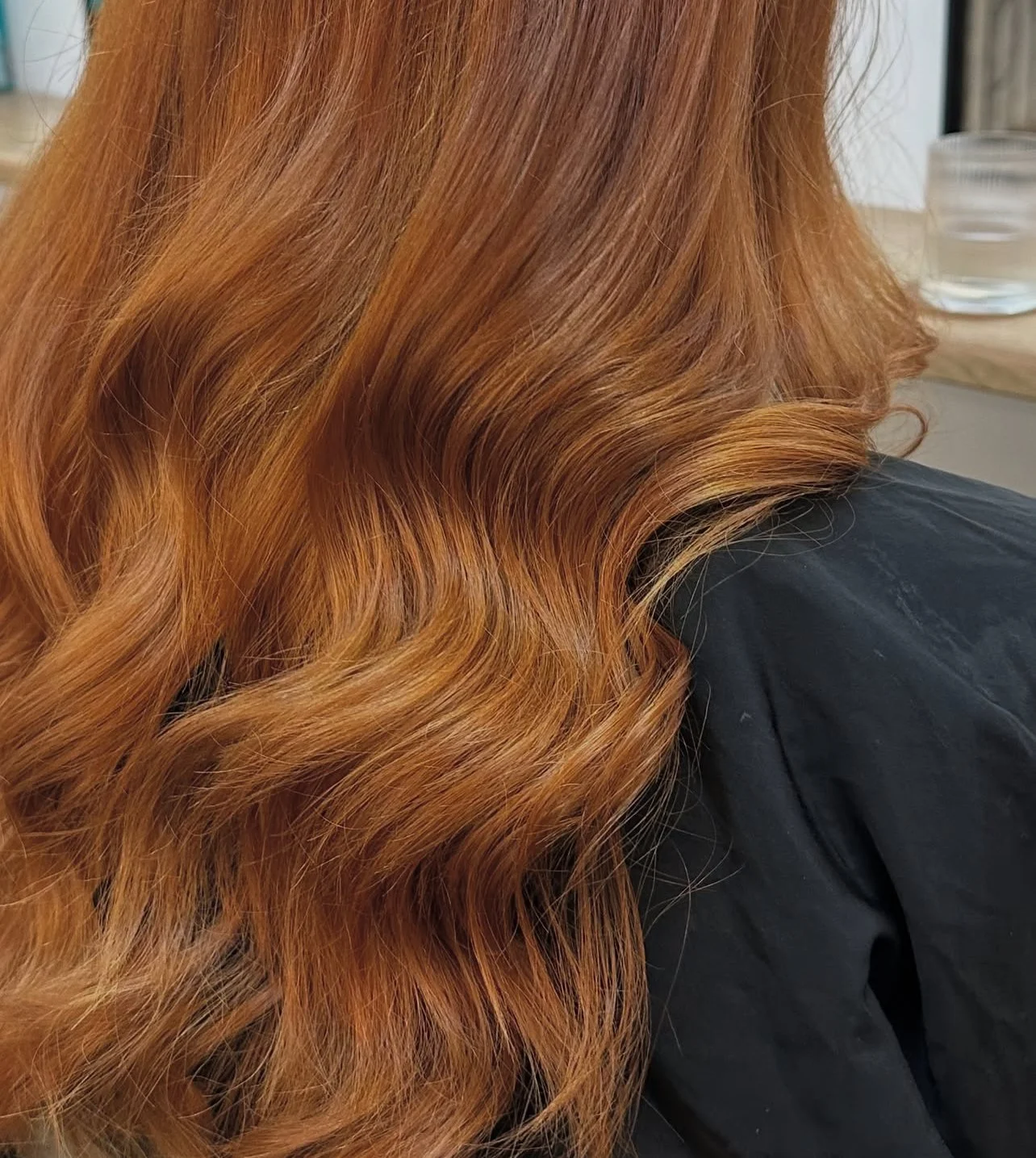 Close-up of long, wavy, red hair.