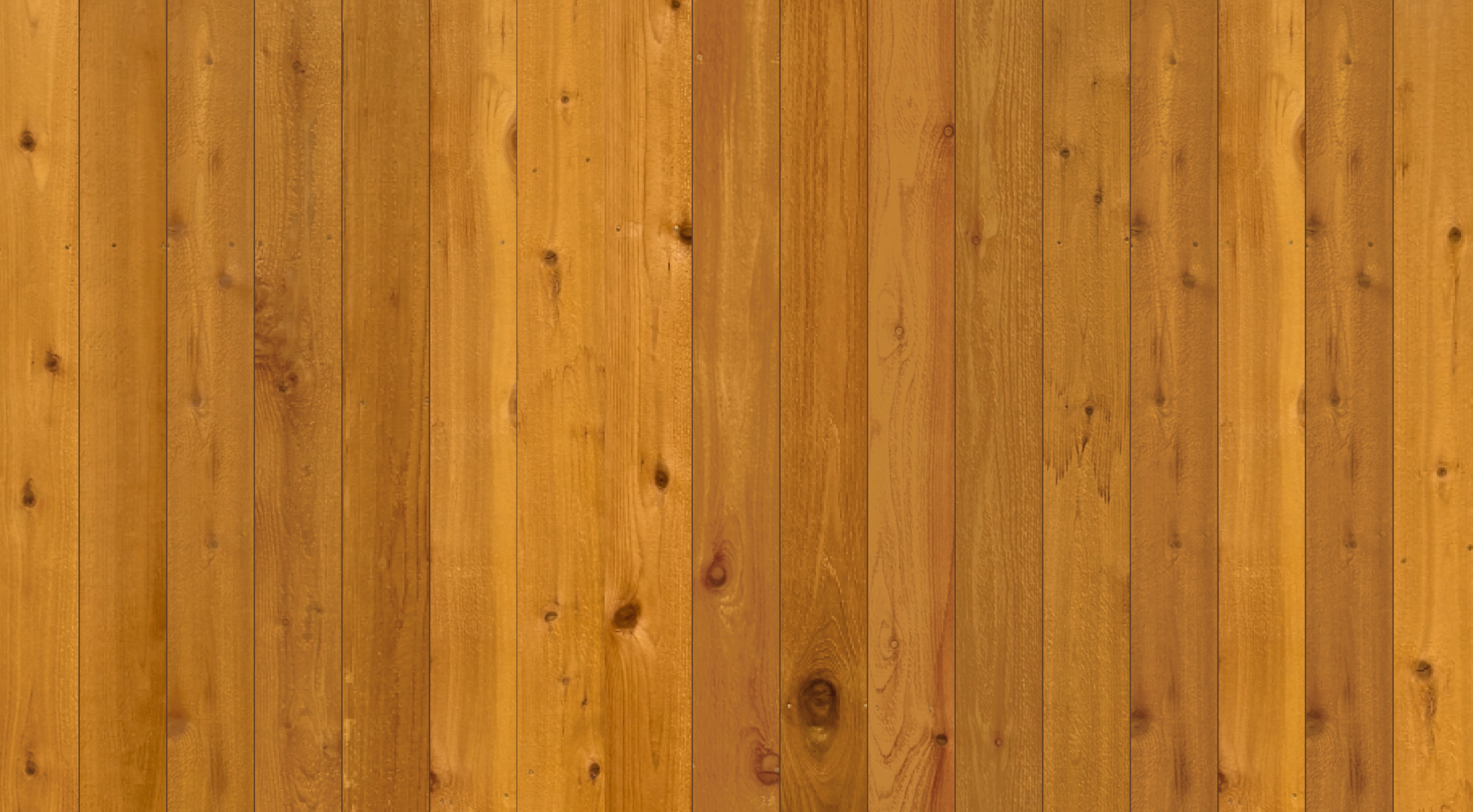 Close-up view of a wooden surface with vertical planks featuring a warm honey-brown stain, showcasing wood grain and knots.