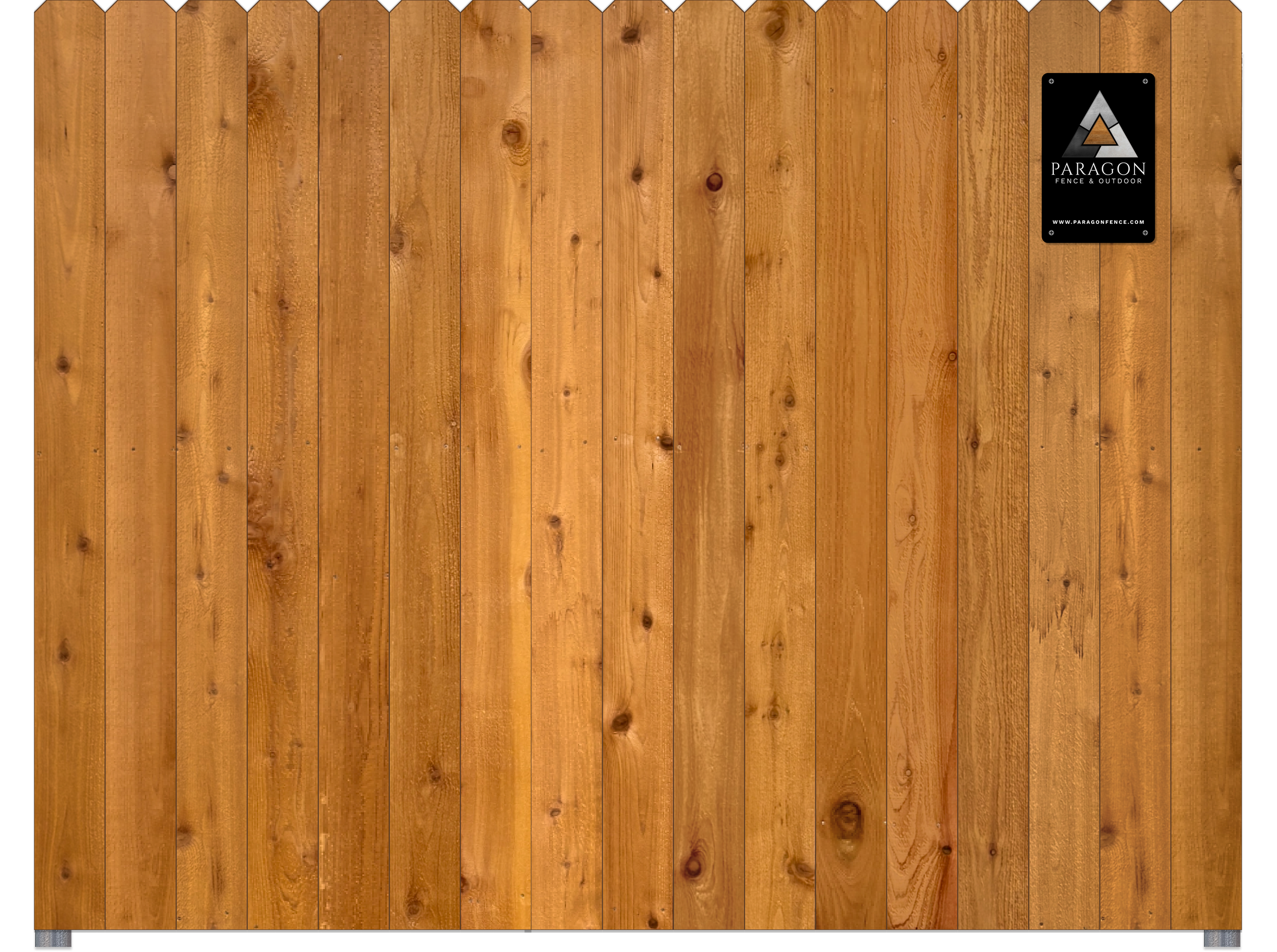 A wooden fence with vertical planks and a black metal plaque in the upper right corner that reads "Paragon Fence & Outdoor" and includes a website address.