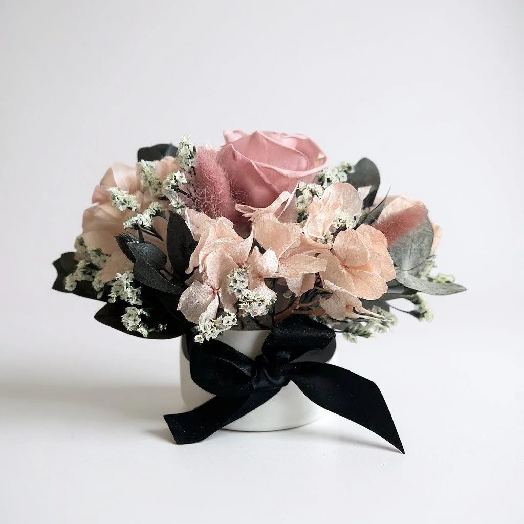 Mini hatbox dried flower arrangement with black ribbon