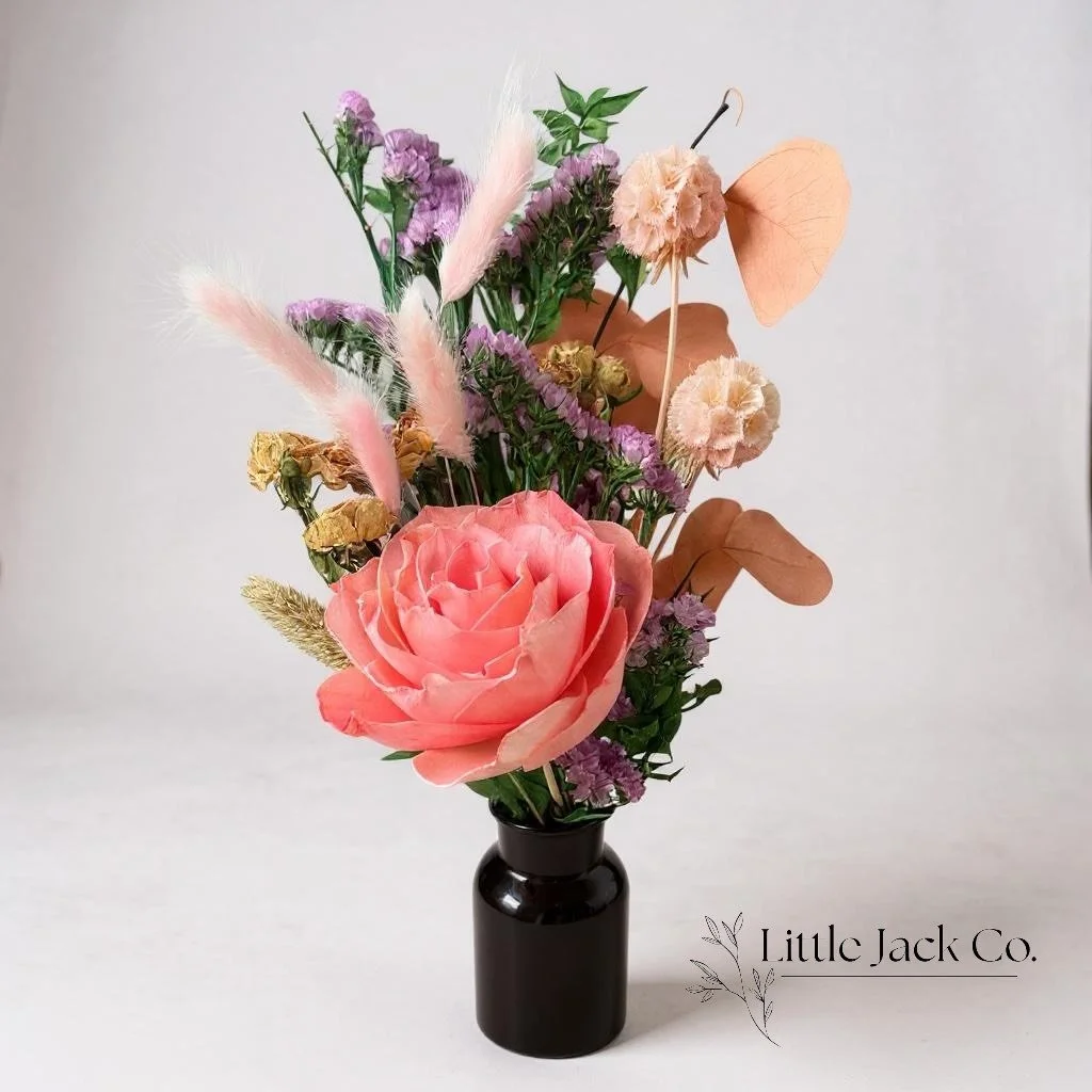 Elegant dried flower arrangement featuring bunny tails, statice, scabiosa and a handmade rose