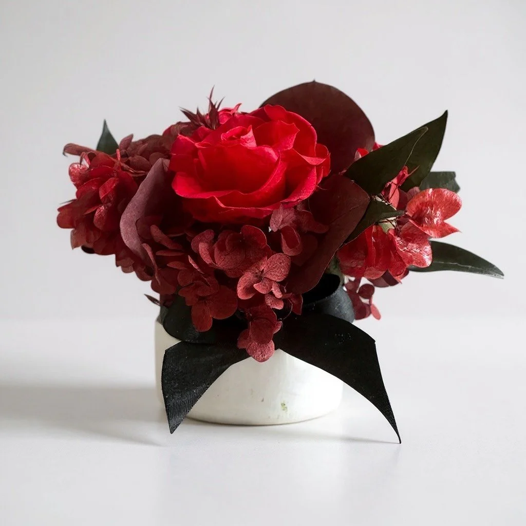 Mini hatbox ruby dried flower arrangement with black ribbon