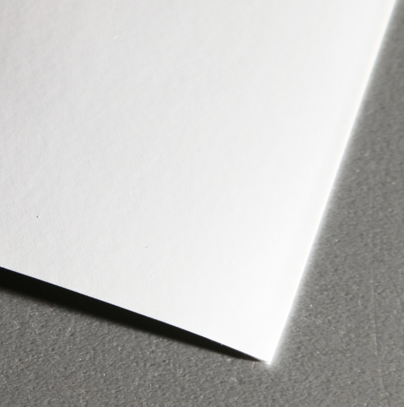 Close-up of vinyl adhesive wallpaper substrate with slight sheen.