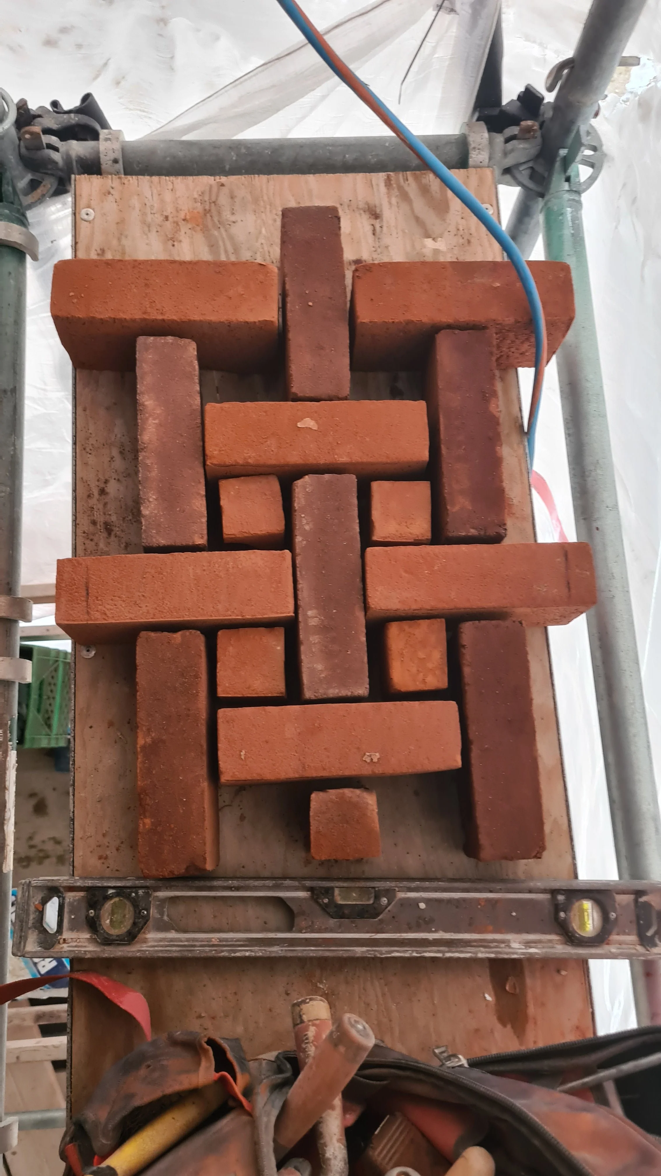 Measuring out for a decorative panel on a Tudor revival style house. This is called a Victorian basket weave and its one of my favorites.  