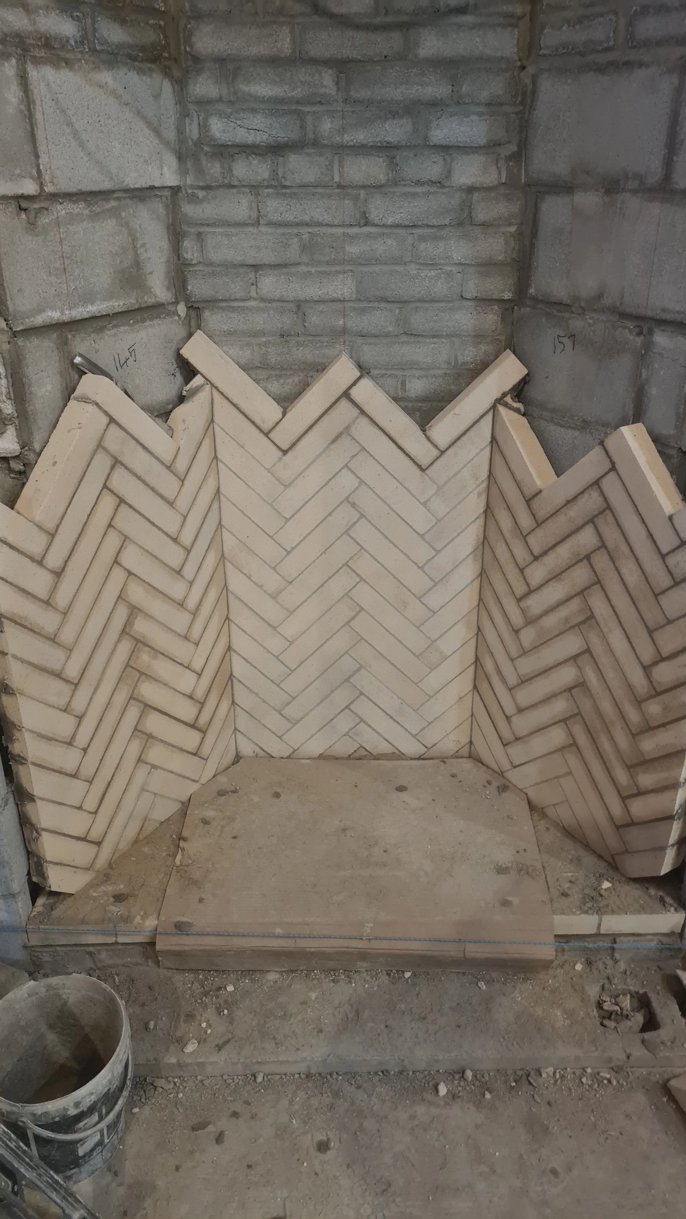 Construction of a perfect firebox in herringbone bond. 