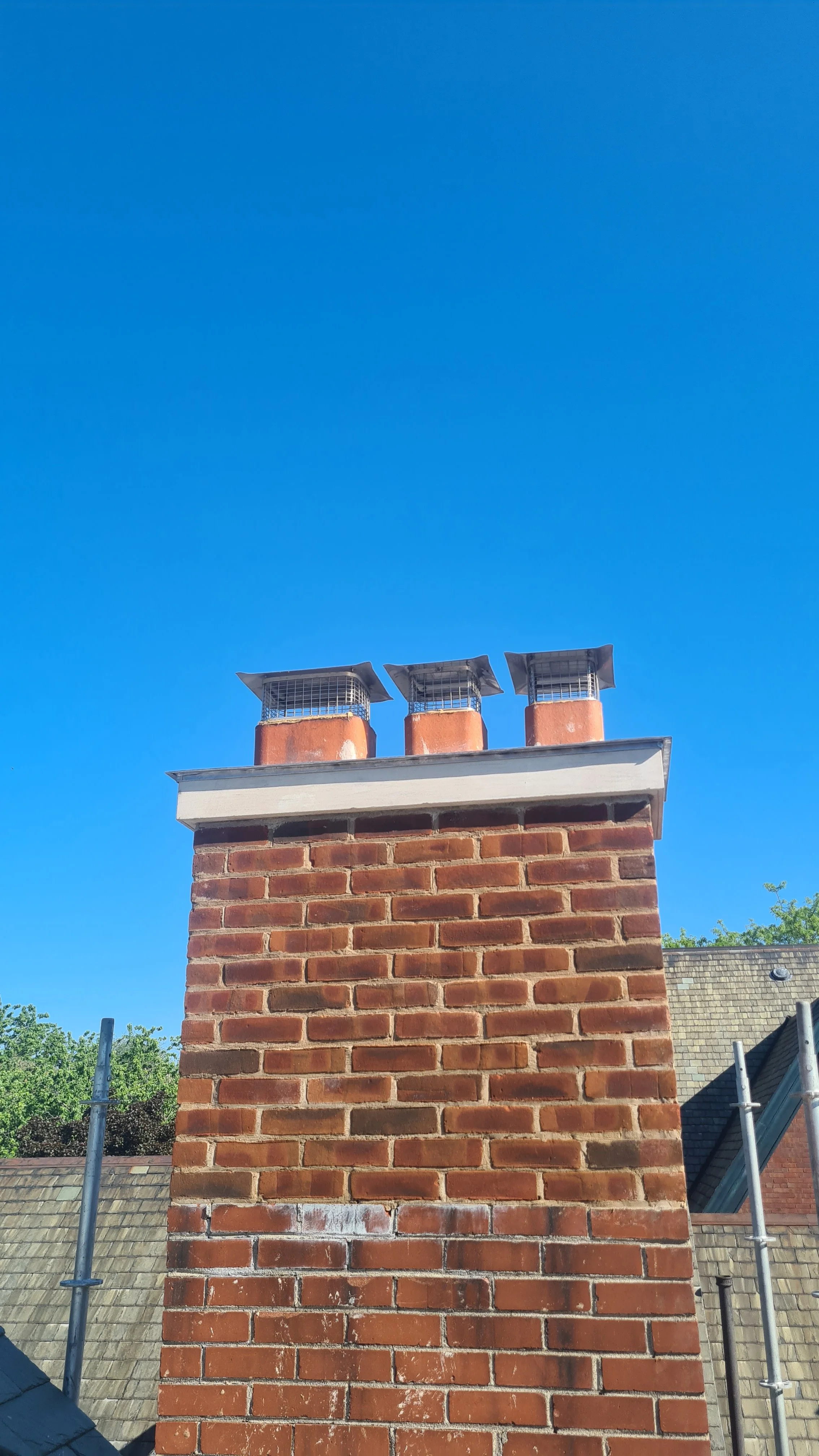 
The top of the chimney was too low and needed raising.