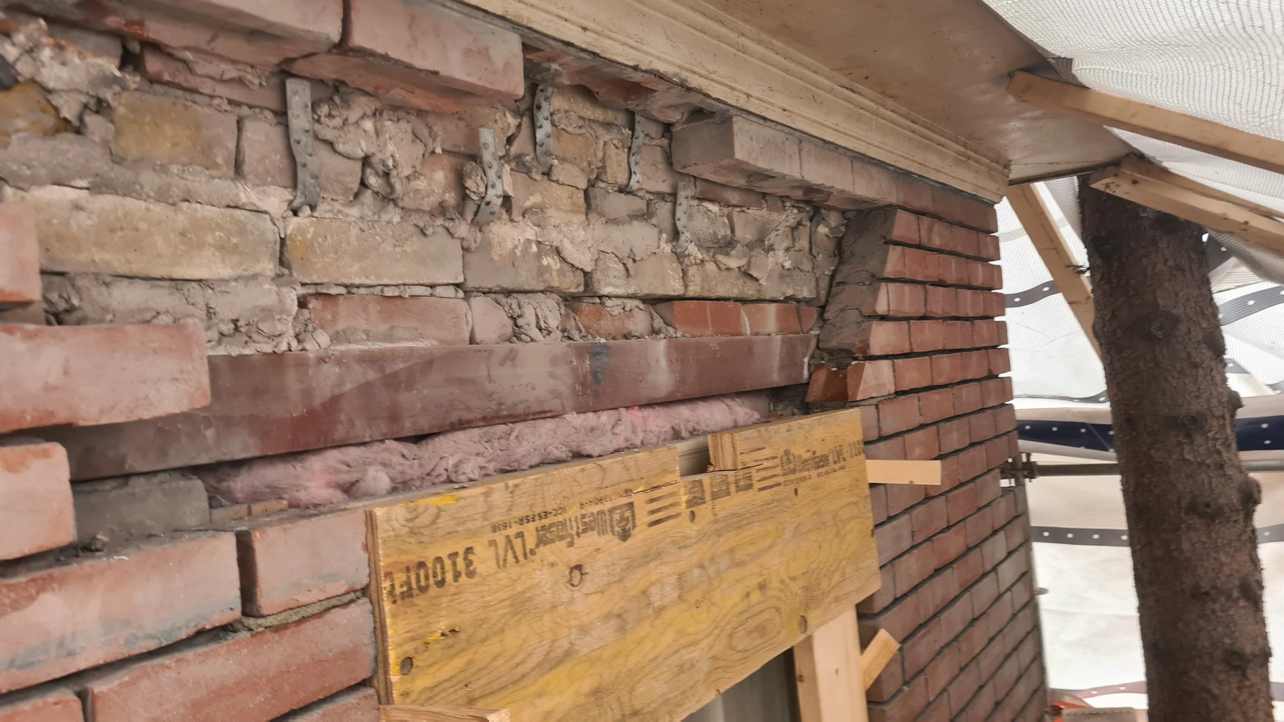 Preparing the masonry to receive some new stones. the angle i have cut back is called the skewback.