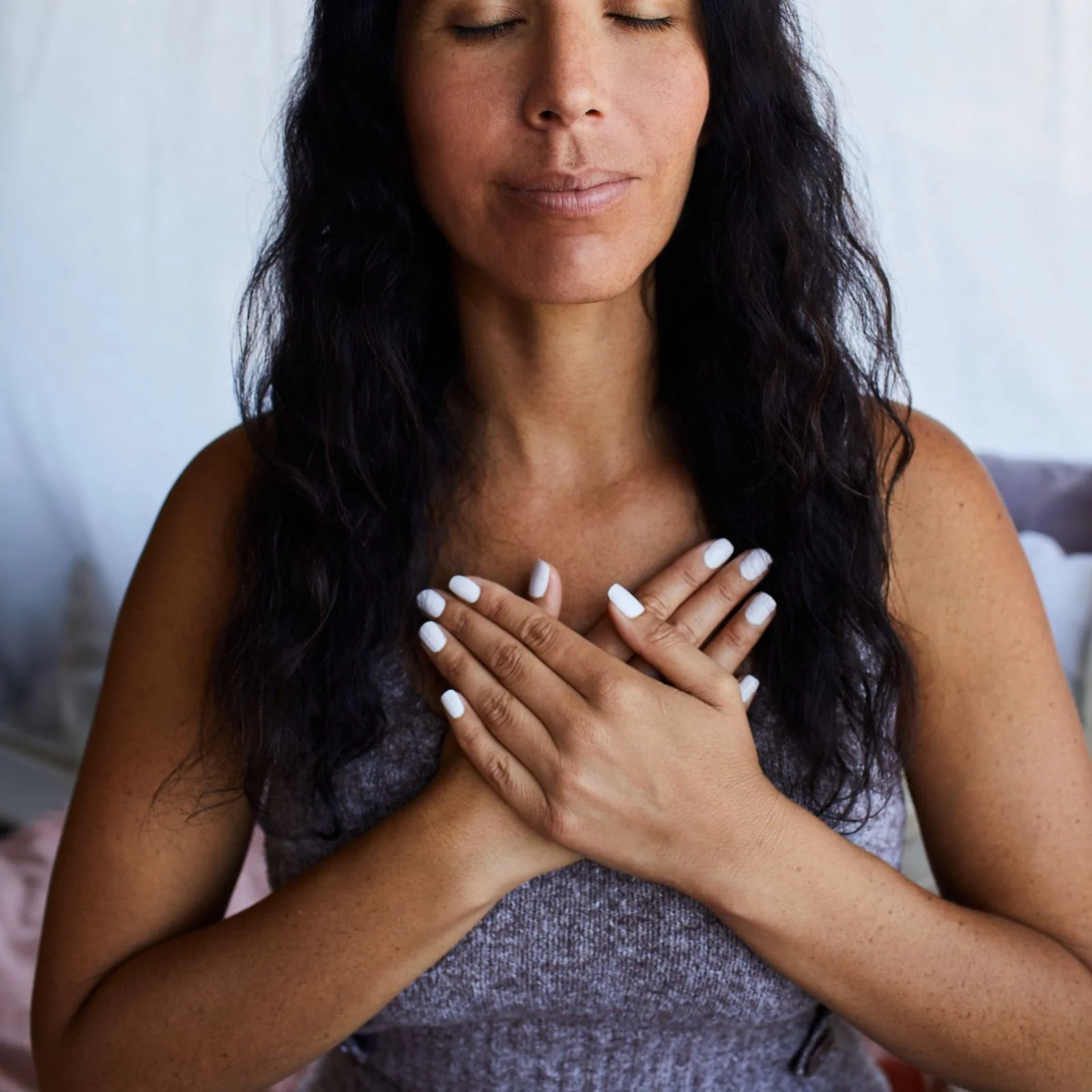 Woman with black hair meditating