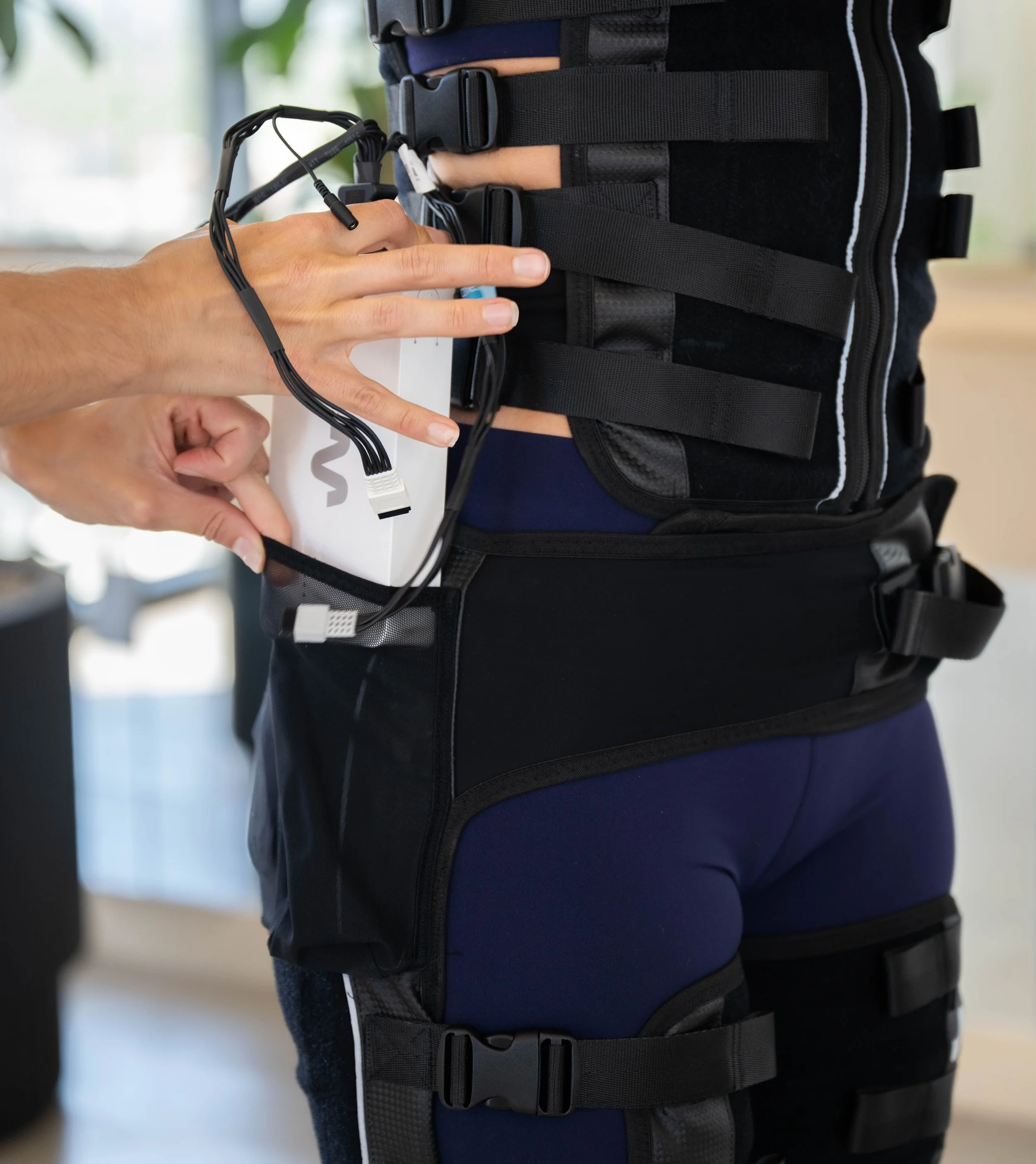 CurrentCor EMS trainer coaching client during in-home workout in Scottsdale