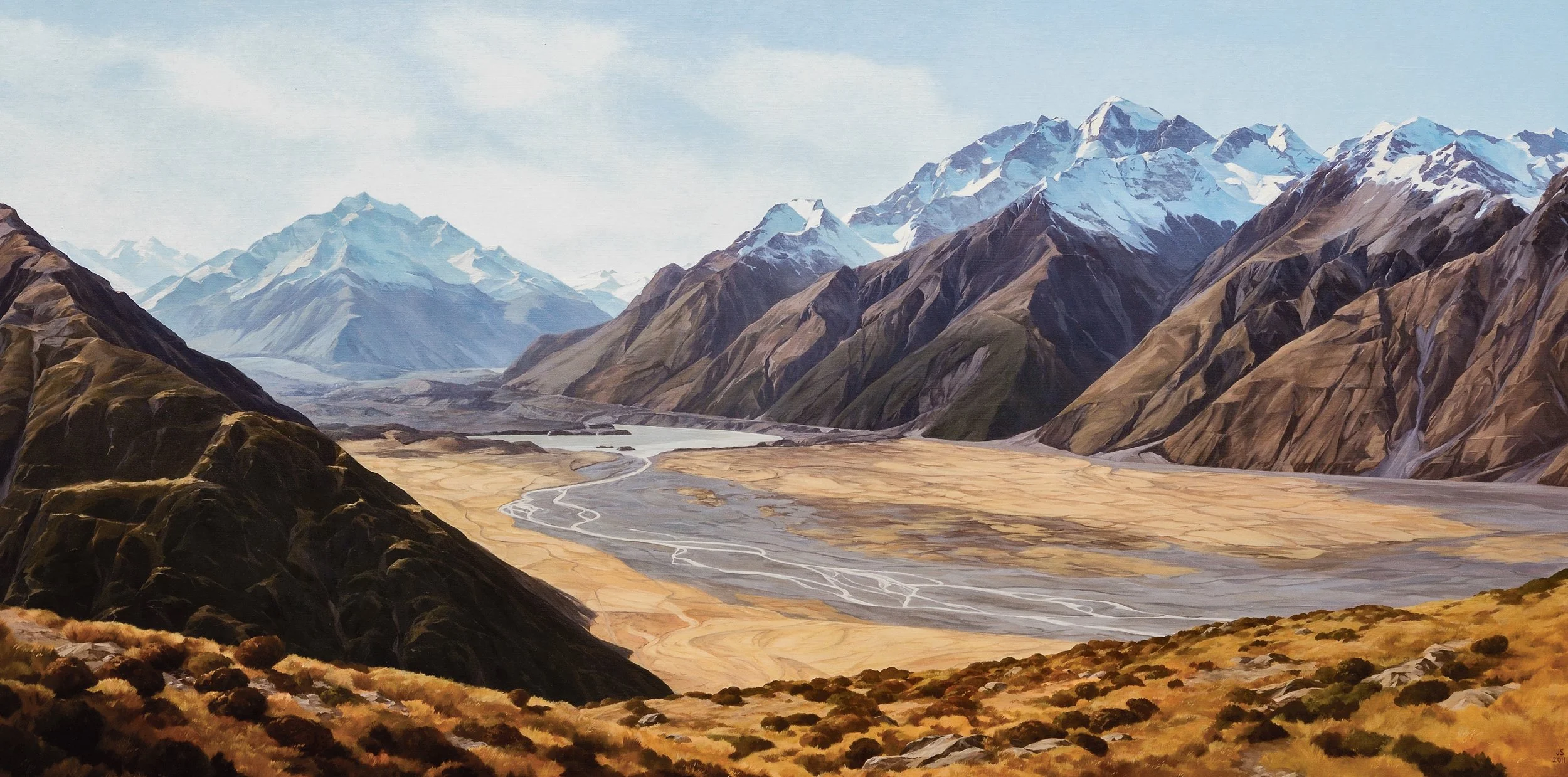 Aoraki Mount Cook, Tasman Valley , rugged brown and green hills, and a winding river flowing through a dry valley.