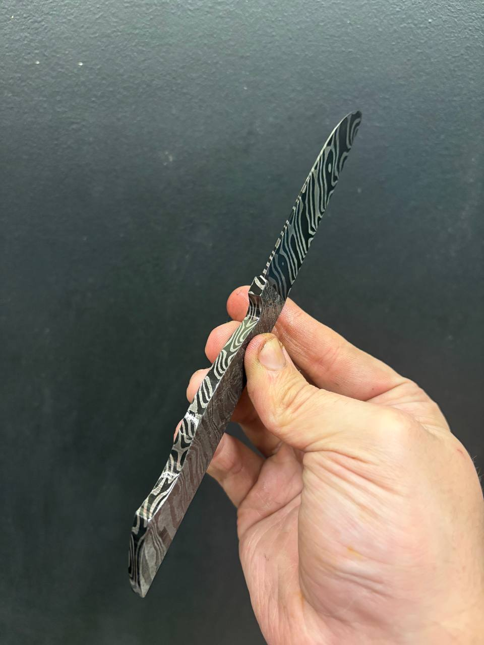 Brut de forge twist damascus with geode finish.