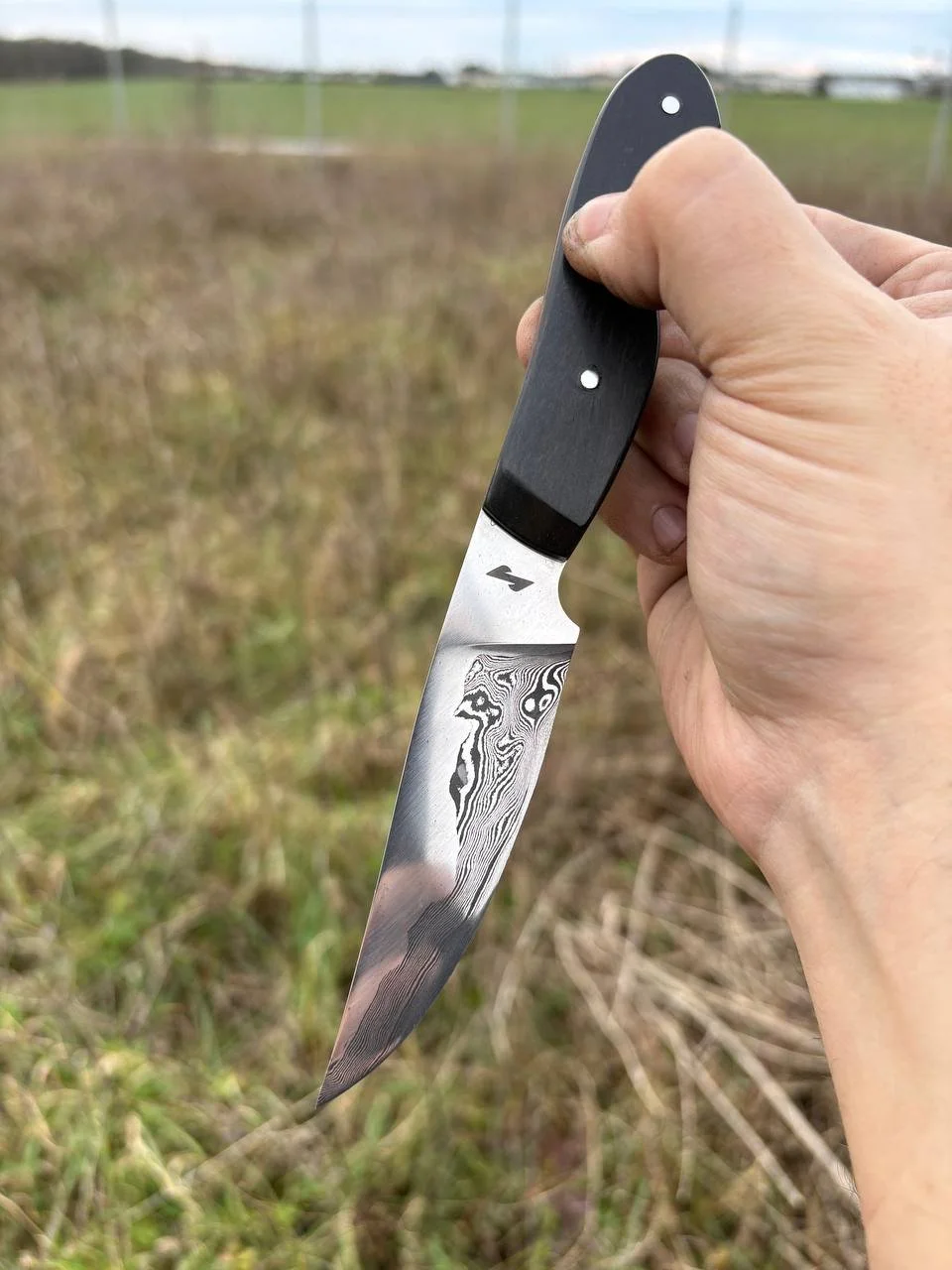 "Eruption", a twist damascus creation with bright steel as cladding.