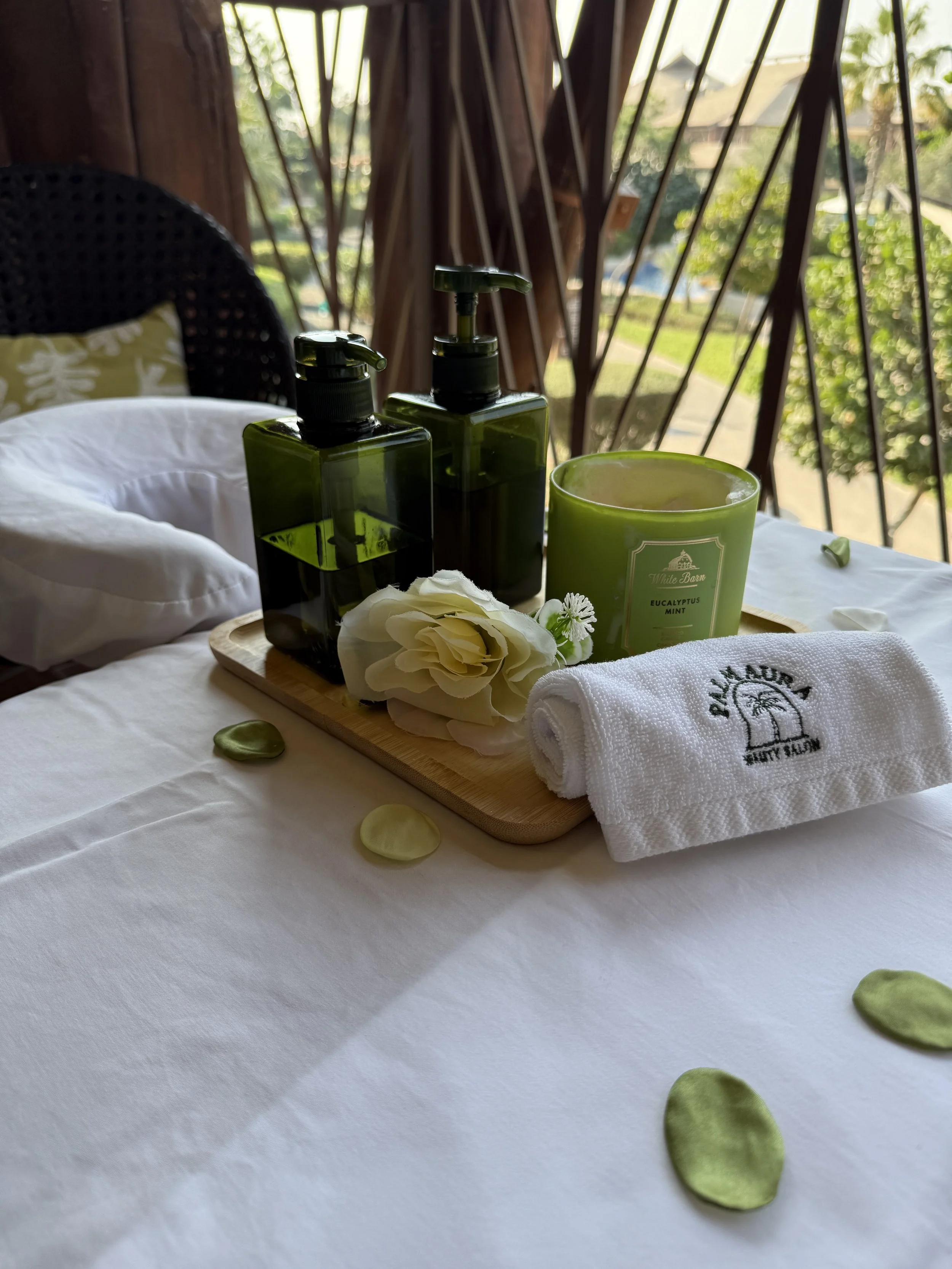 home massage setup with bed and oil