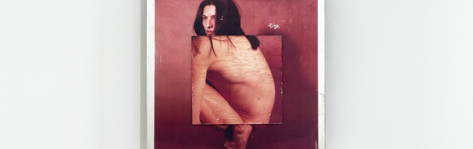 Mixed media artwork featuring a portrait of a woman with dark hair and a nude body, with the image layered and textured on a reddish background.