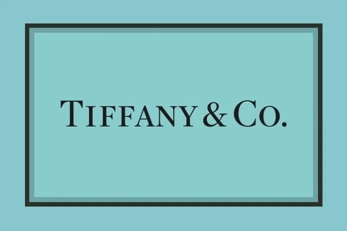 Tiffany & Co. logo on a light blue background.