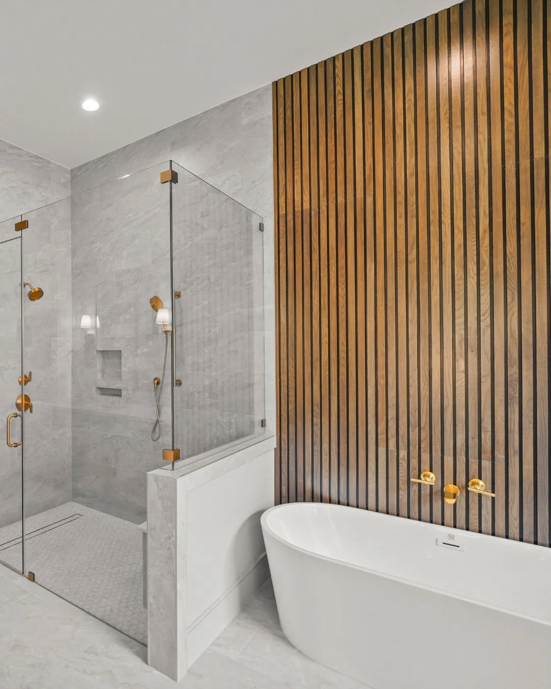 Design like this is all about balance - warm vs. cool, soft vs. structured.

The wood wall adds warmth and texture, the contemporary tile keeps it polished, and the brass details add a subtle, luxe finish. ✨

The kind of mix that feels easy - because