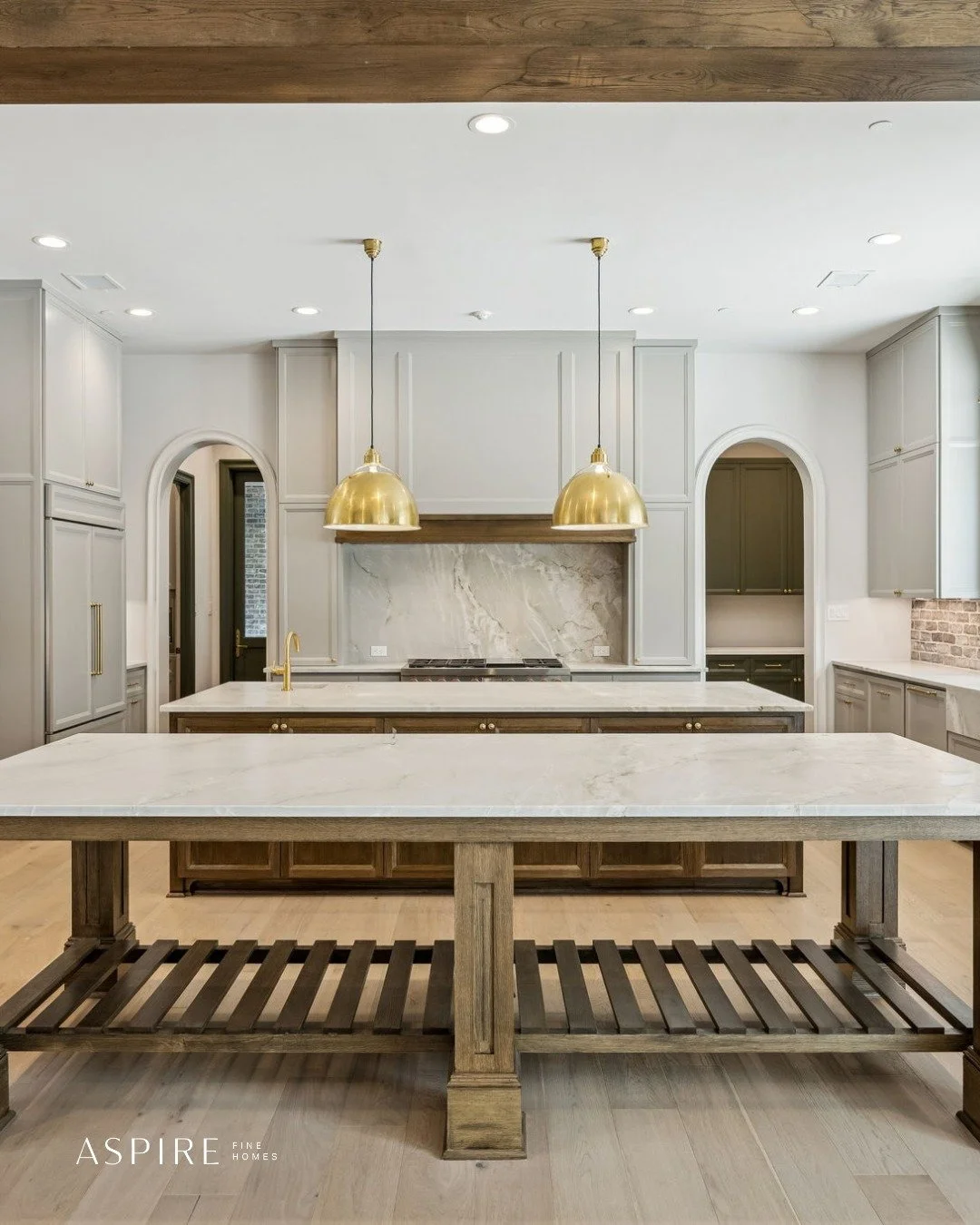 Another look at the kitchen in our custom home on Fries Road.

There are a lot of details in this space to love, from the double island to the hidden bar and seamless connection to the backyard.

What&rsquo;s your favorite part? 👀
.
.
.
.
.
#Kitchen