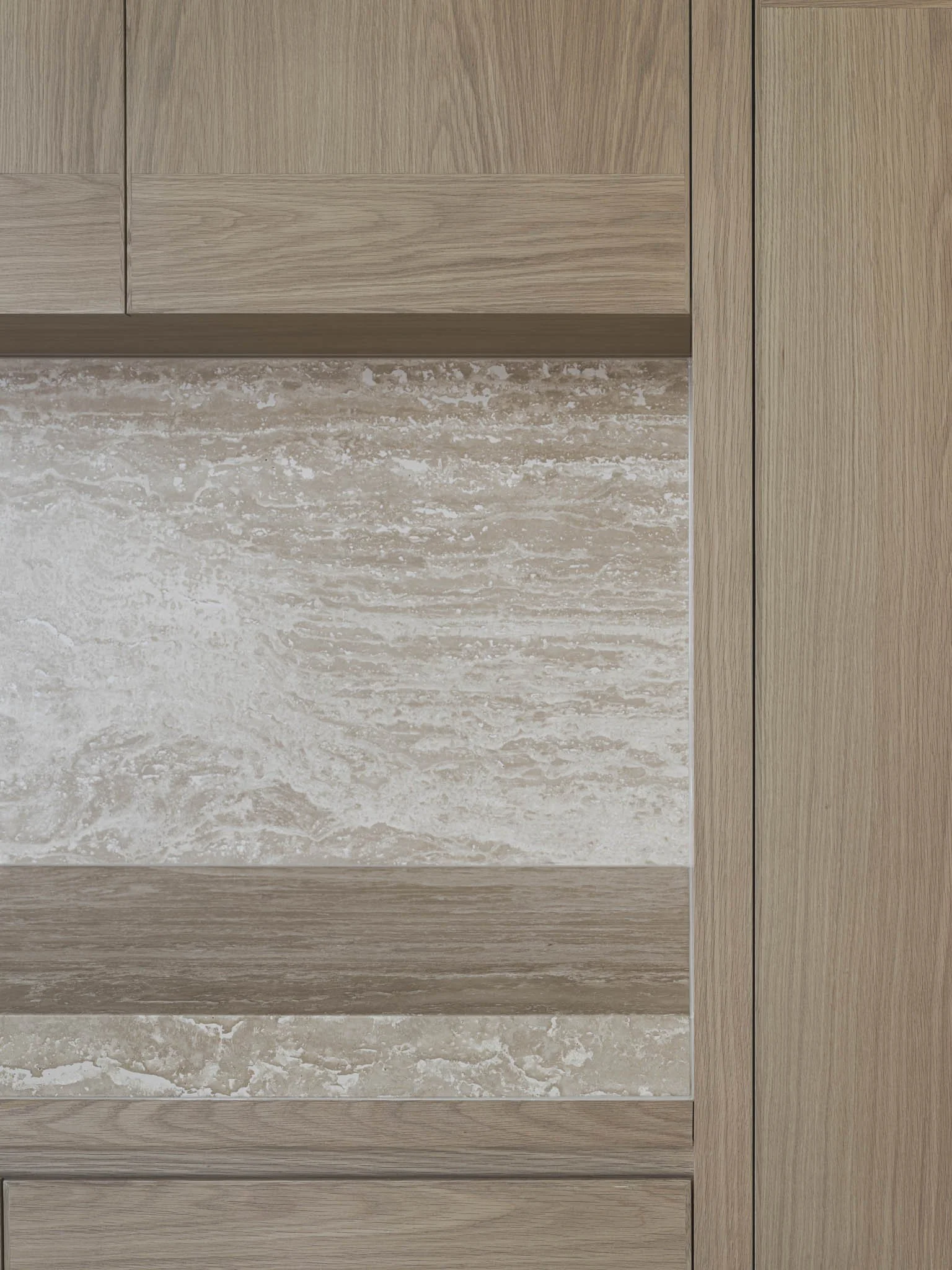 Close-up view of a wooden cabinet with a marble or stone insert panel.