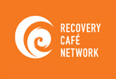 Orange background with white spiral logo and the text 'Recovery Café Network'.