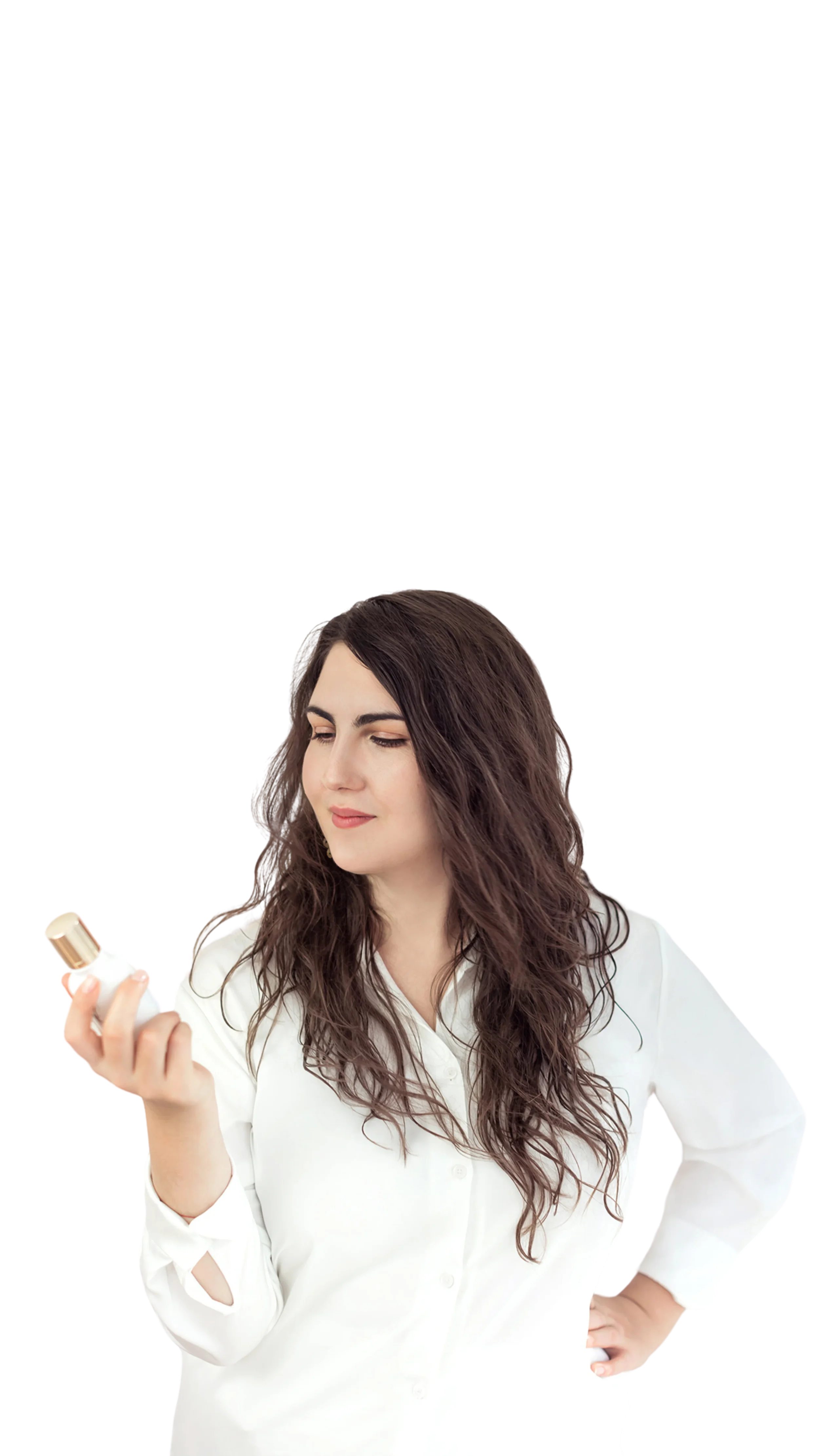 Nyárádi Natália Hungarian perfumer holding the Tihanyi Visszhang (Echo of Tihany) signature fragrance bottle.