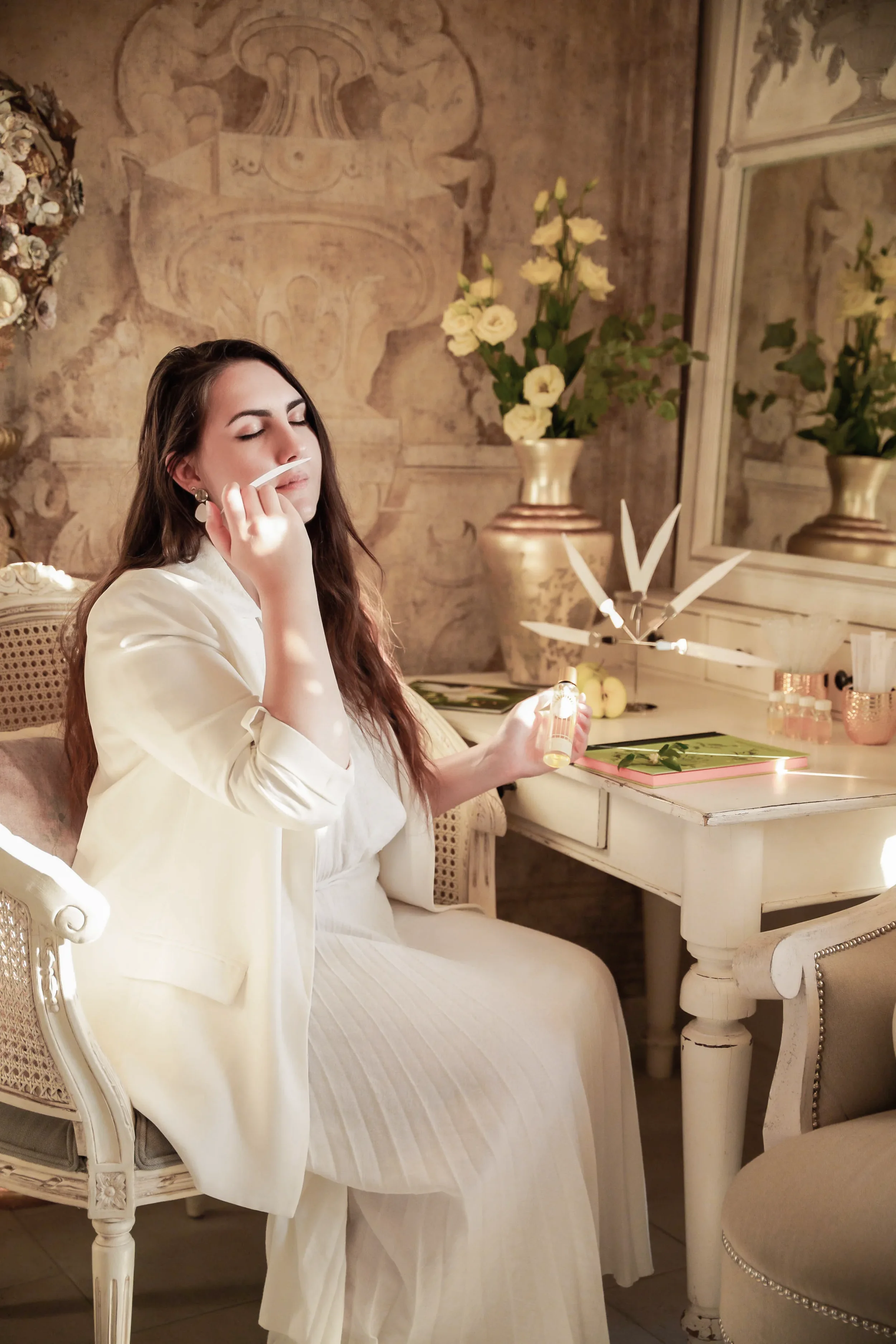 Independent perfumer Nyárádi Natália conducting a private olfactory consultation for bespoke signature perfume creation in an elegant atelier setting.