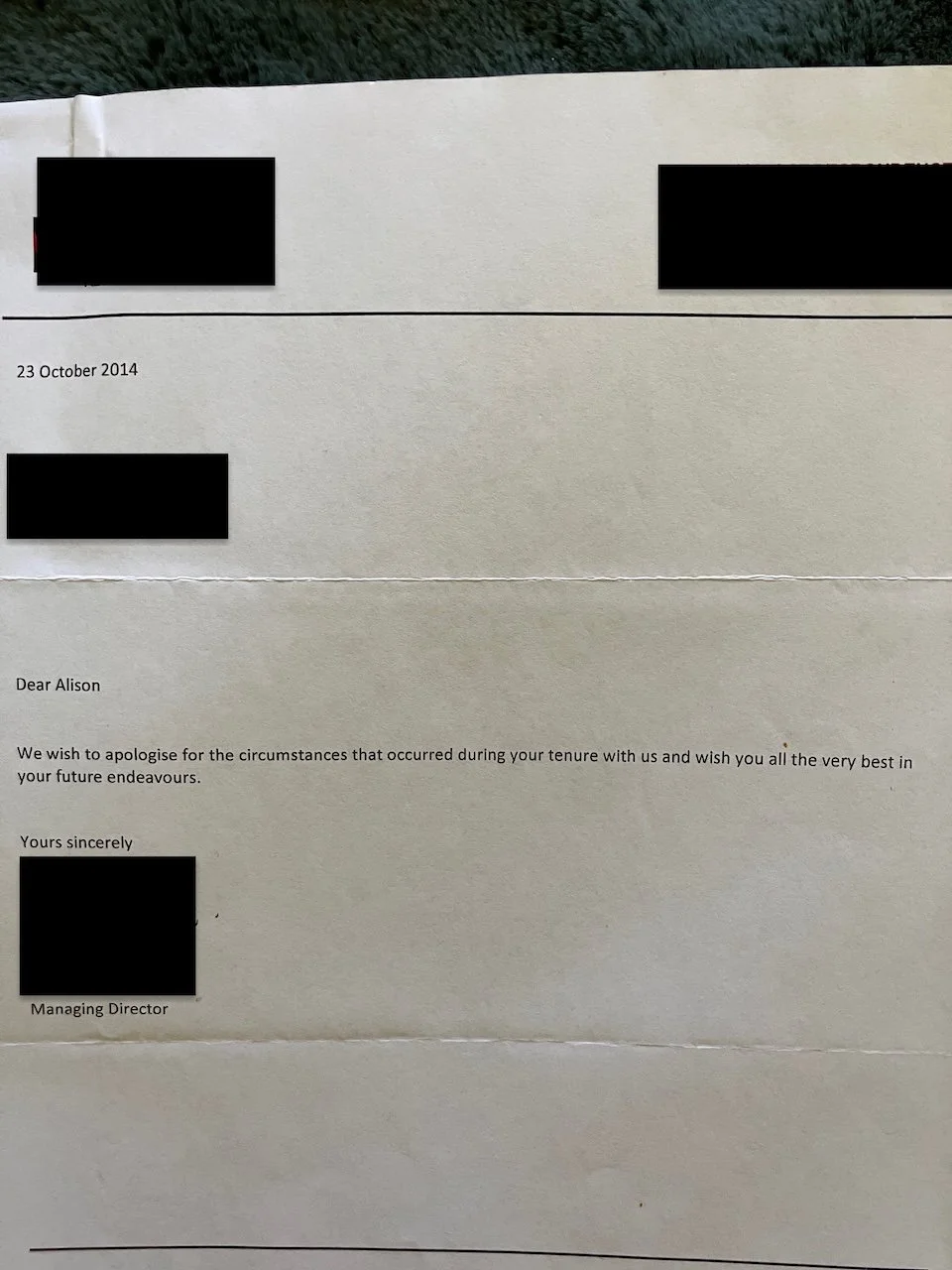 Redacted handwritten apology letter on plain paper from a former employer