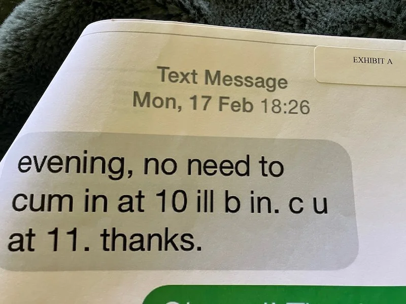 Screenshot of text message exhibit showing a message from a boss reading “cum in at 10 ill b in. c u at 11. thanks.”