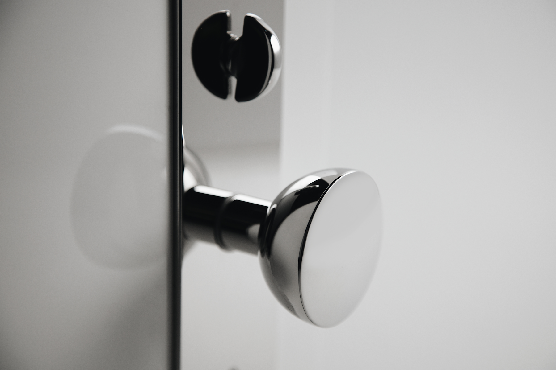 modern and timeless door knob and escutcheon in polished nickel.