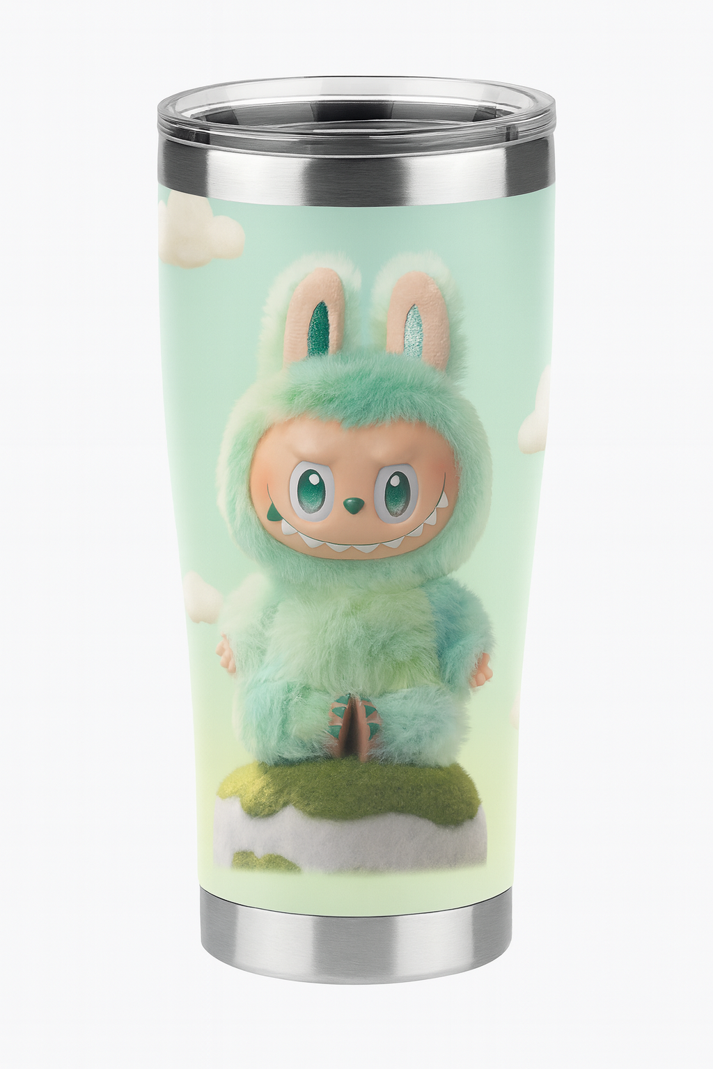A tumbler with an animated character design of a furry creature with bunny ears, large eyes, a toothy smile, and a playful expression, sitting on a patch of grass with clouds in the background.