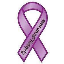 Purple awareness ribbon with the words 'Epilepsy Awareness' written on it.