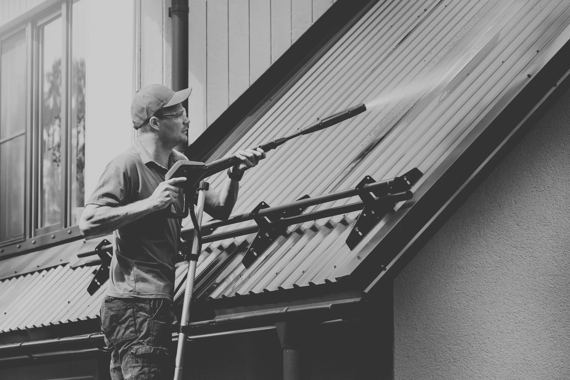 Exterior maintenance work, removing dirt and contaminants to extend the lifespan of commercial building surfaces