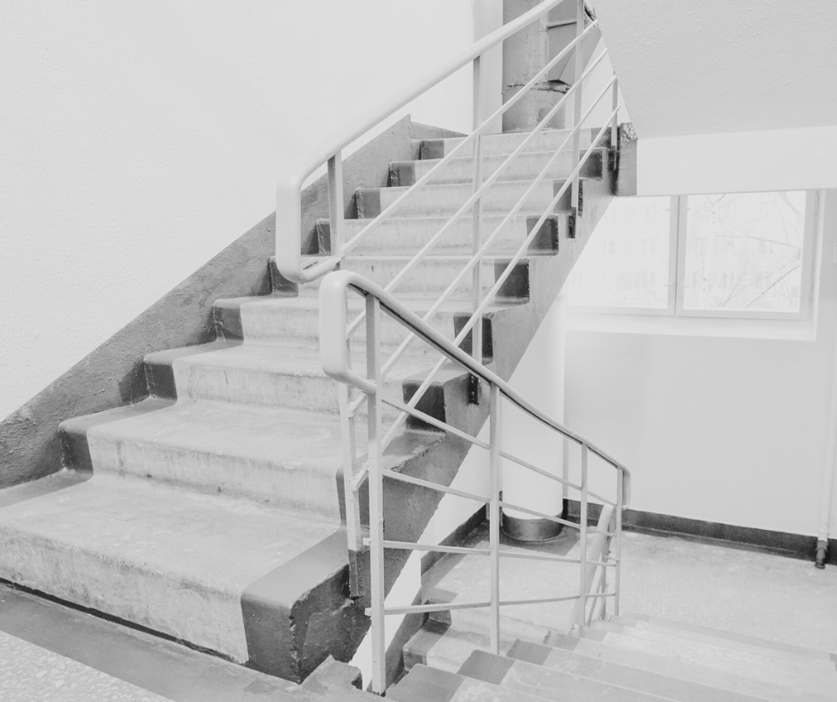 Clean stairwell inside a public building, symbolizing commercial cleaning services and routine maintenance for government and municipal properties.