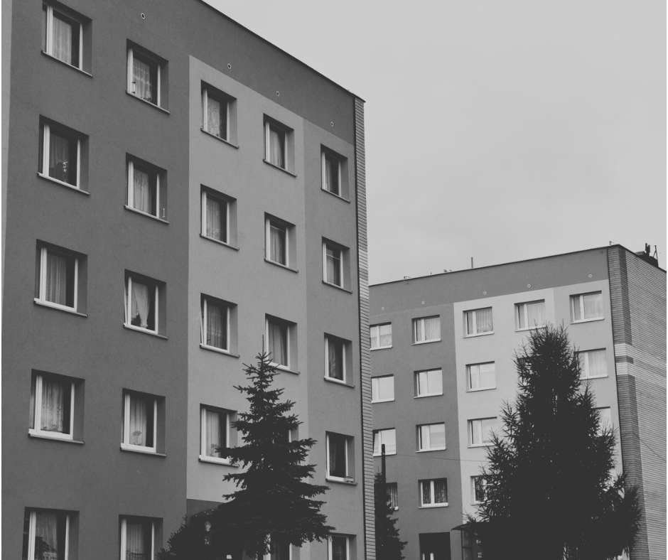 Exterior of multi-story residential buildings maintained through commercial and janitorial services for municipal and community housing facilities.
