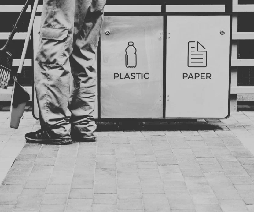 Waste and recycling station maintained by a janitorial company as part of daily commercial cleaning services.