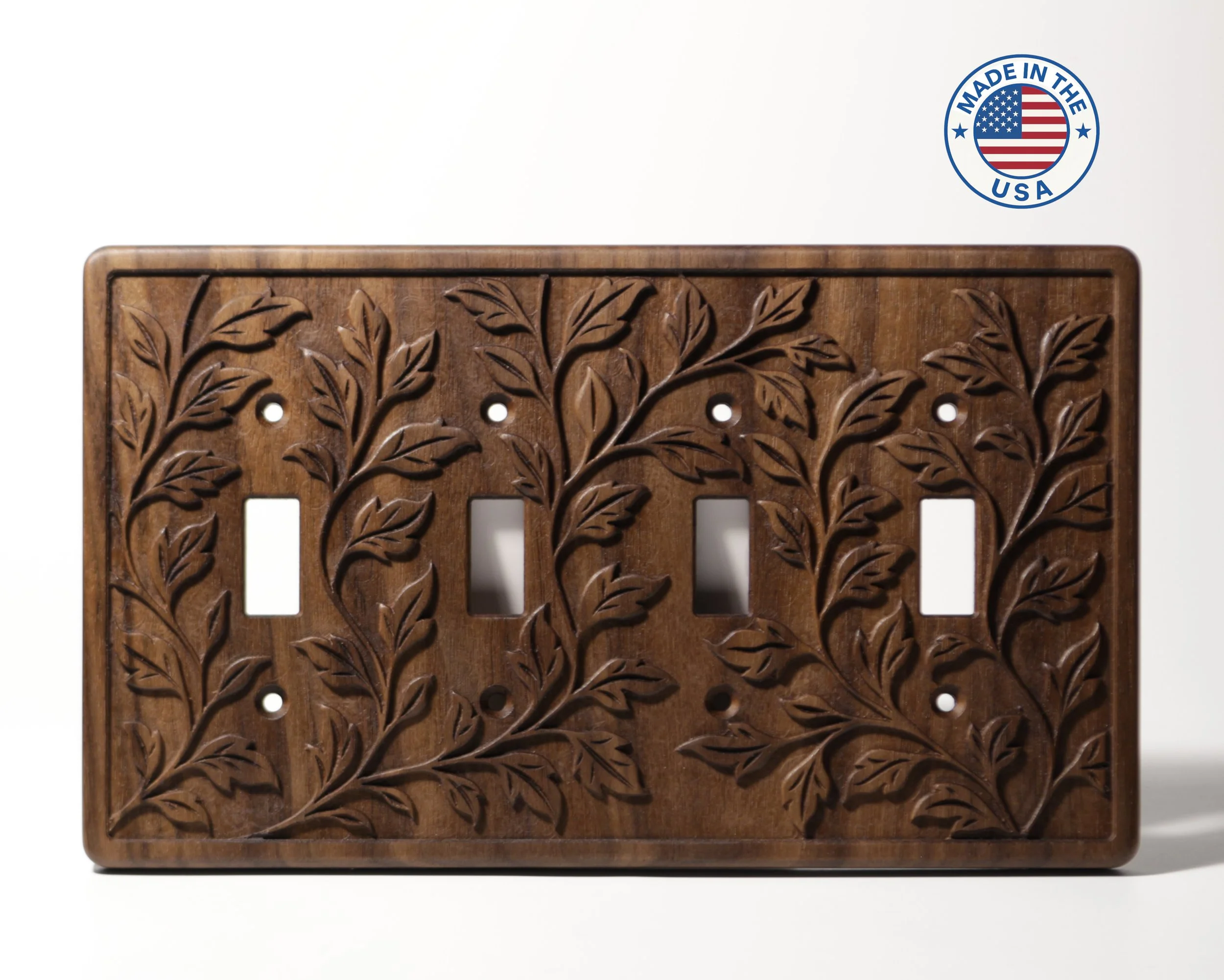 A wooden panel with intricate carved leaf and branch patterns.