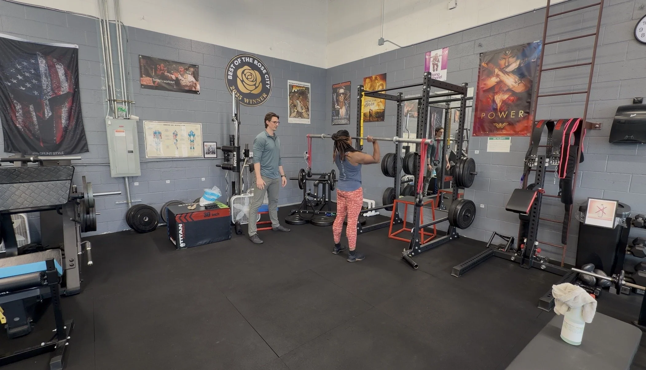 Dr. Ryan Eckert helping client with unstable overhead pressing.