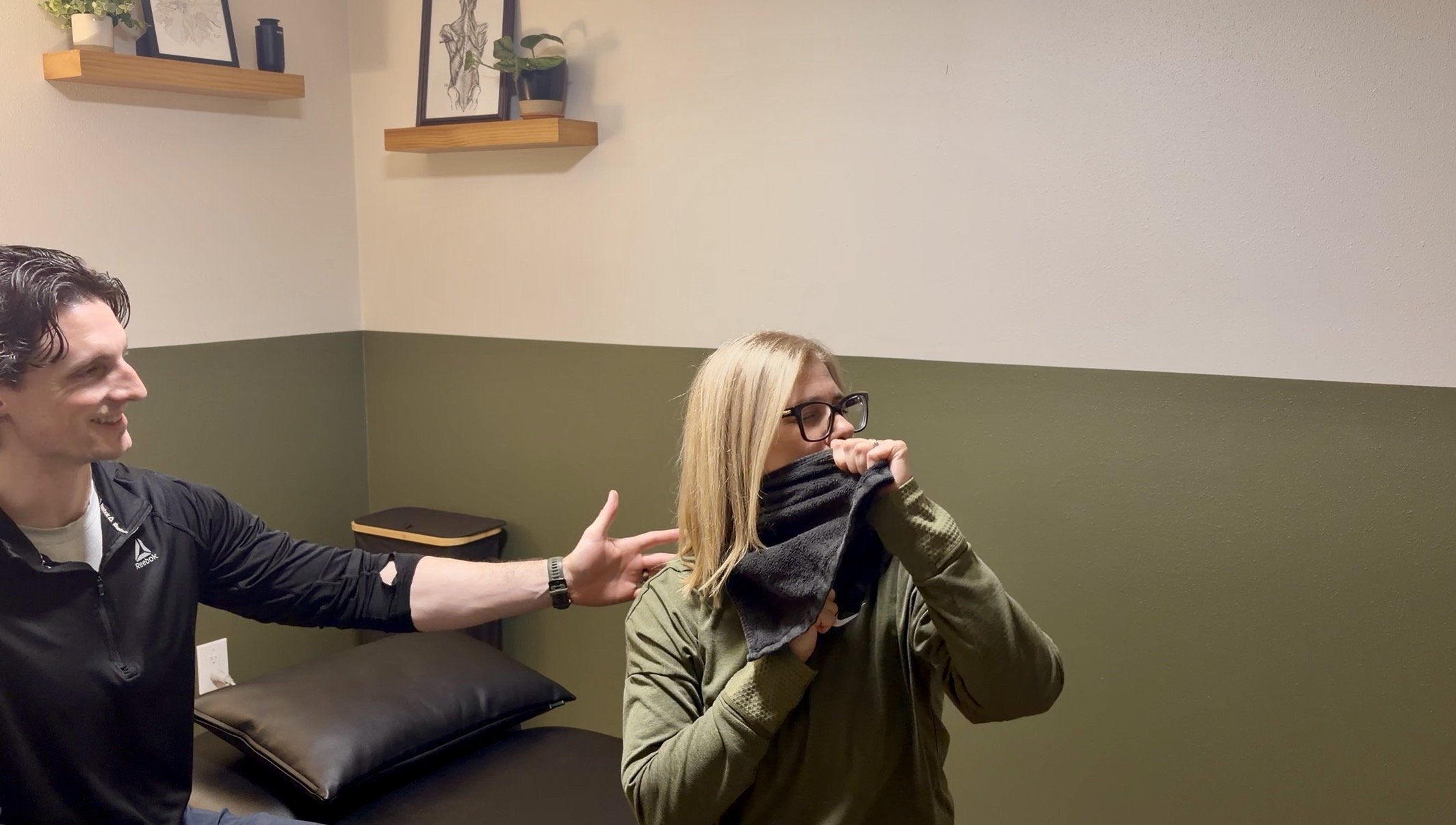 Patient performing a cervical SNAG to help with headaches