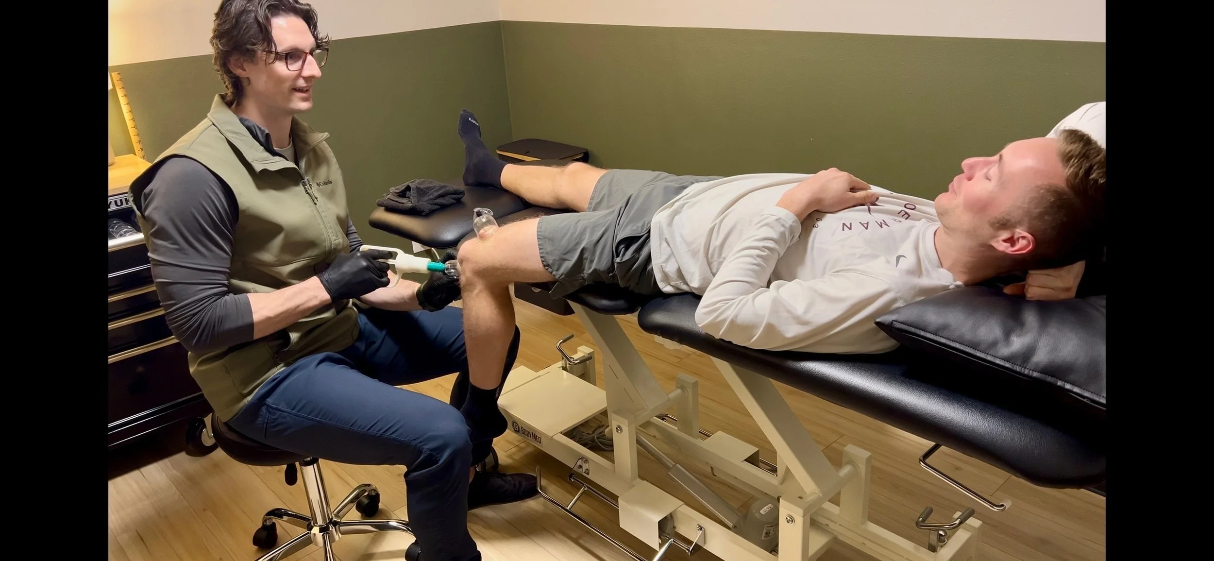 Dr. Ryan Eckert performing manual therapy at Timber and Iron Physical Therapy in Happy Valley, Oregon